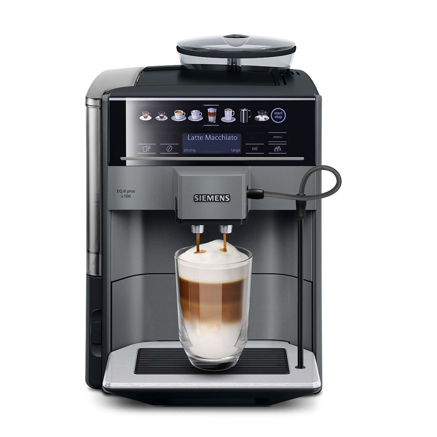 A coffee machine pouring coffee into a glass. The glass has layers of liquid.