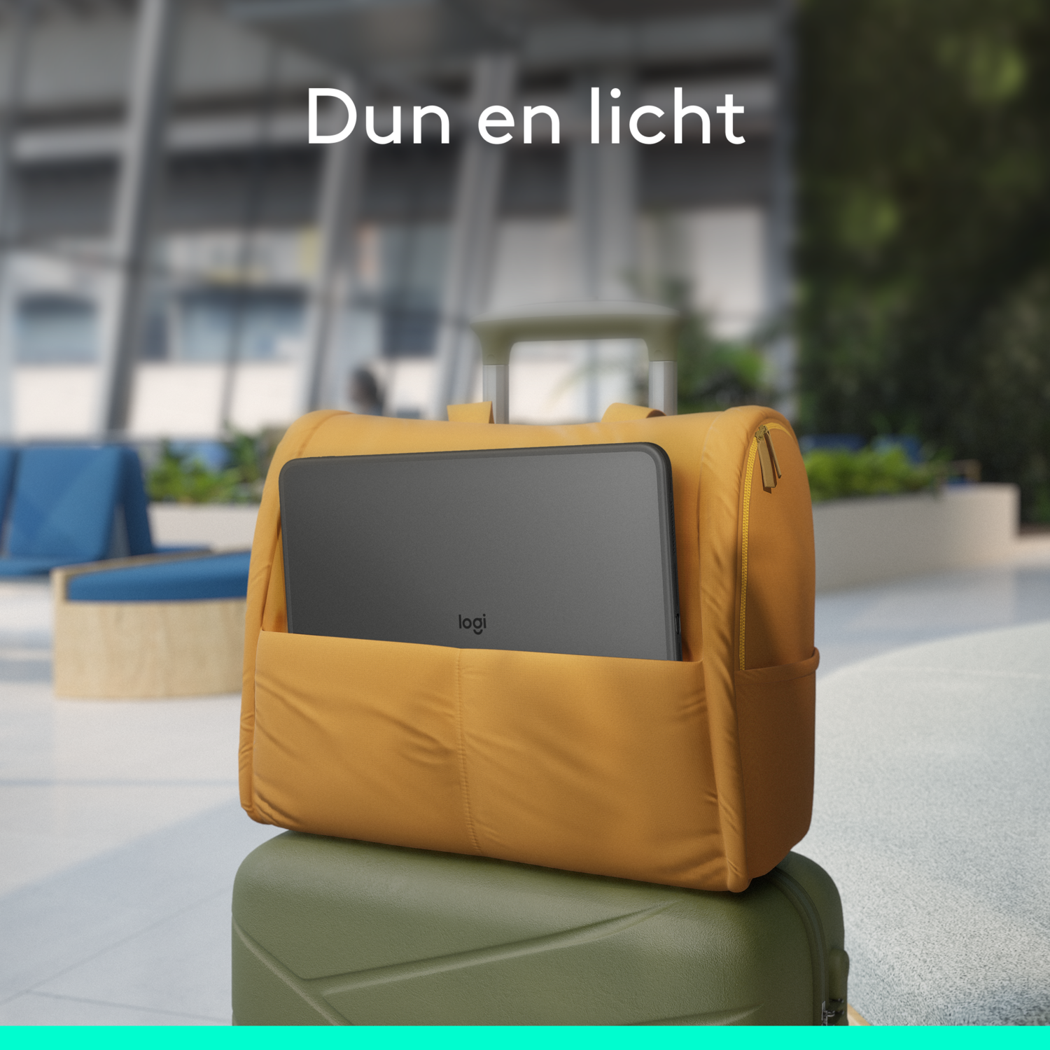 Yellow backpack on green luggage. A laptop is in the backpack's front pocket.