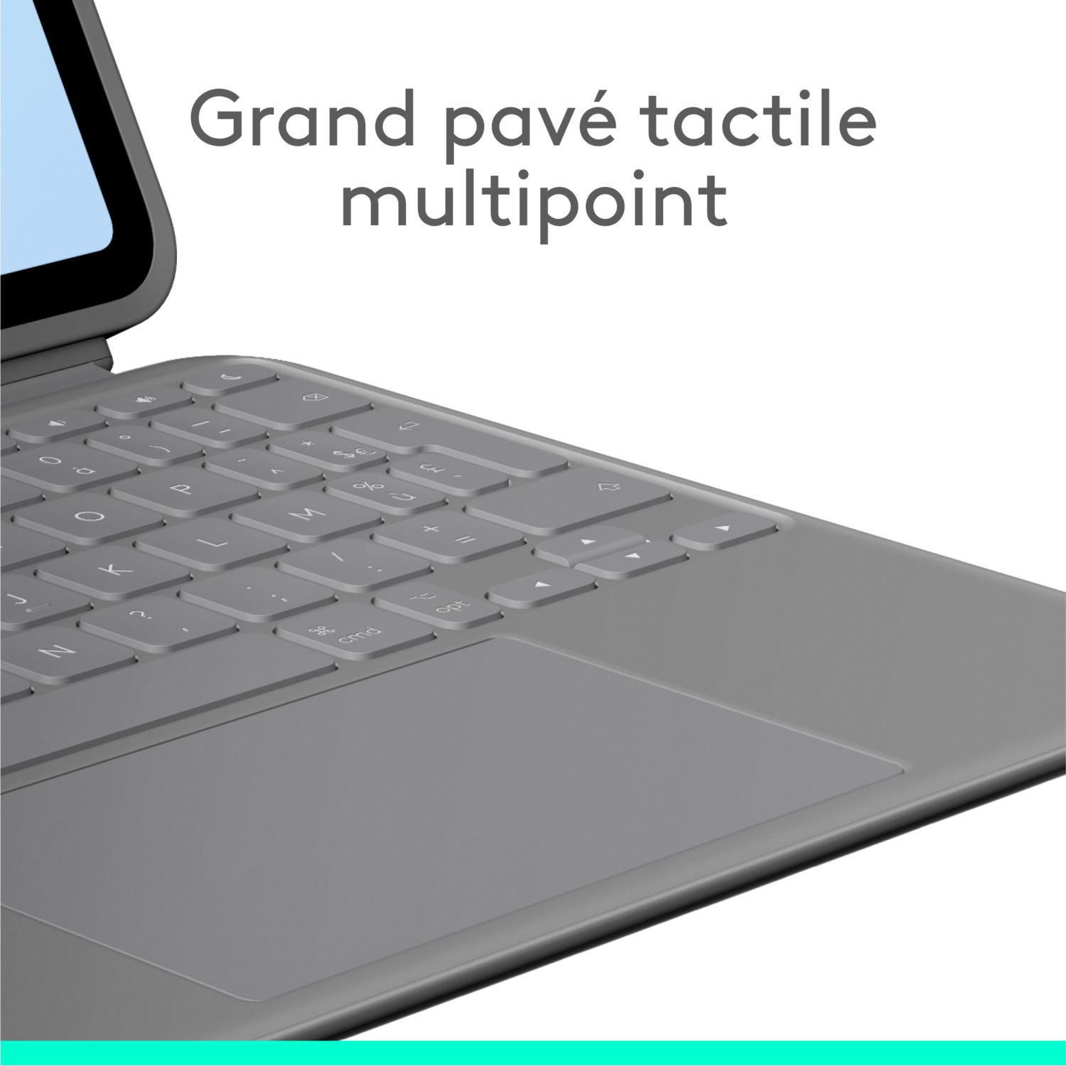 Un clavier gris avec pavé tactile, en gros plan.