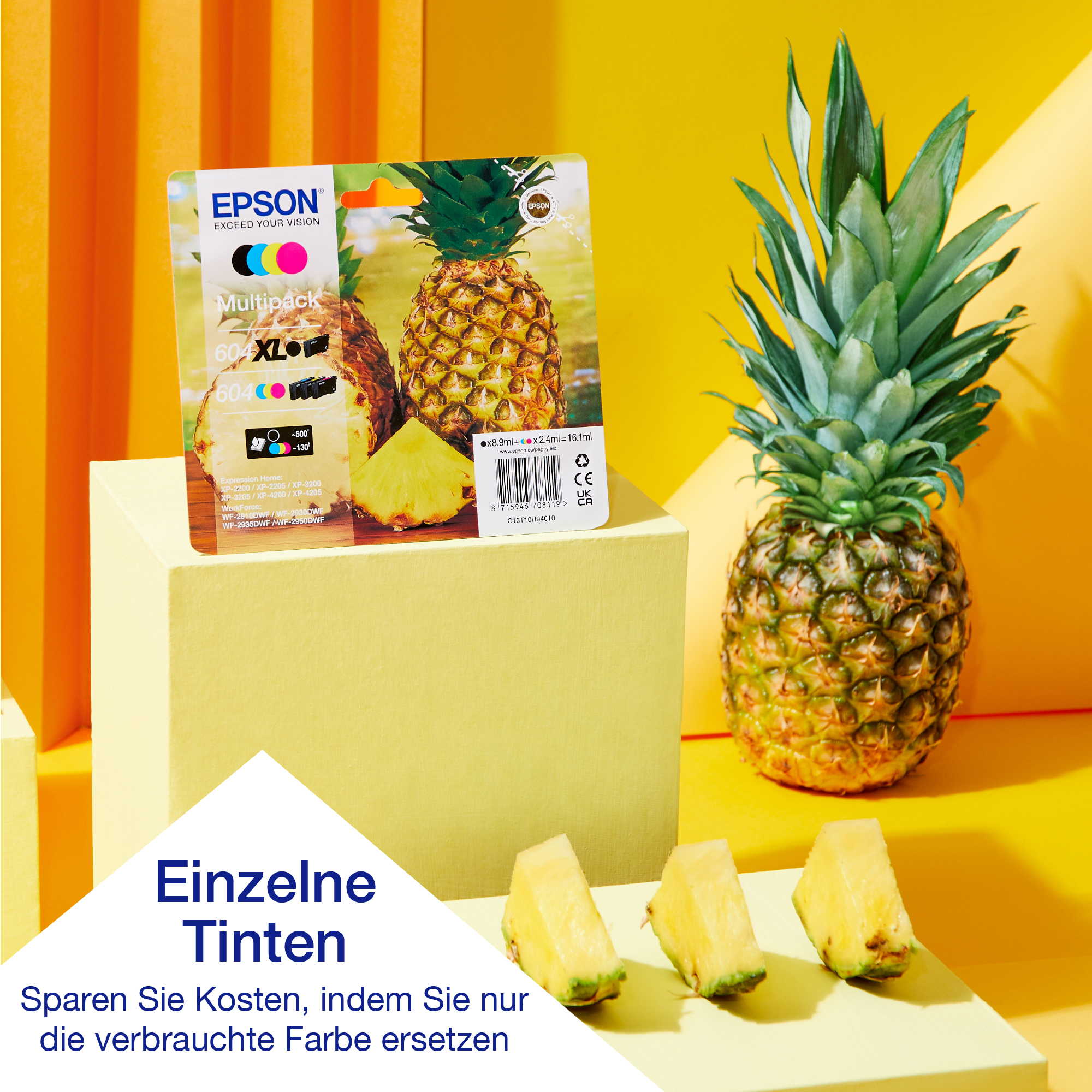 Epson Tintenpatronen und eine Ananas mit Scheiben auf gelbem Hintergrund.