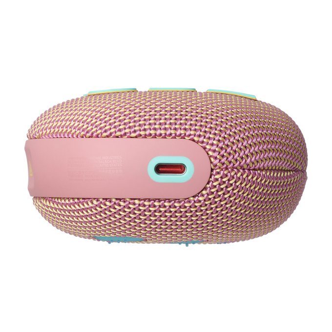 Un altavoz JBL rosa y amarillo con puertos en el lateral.