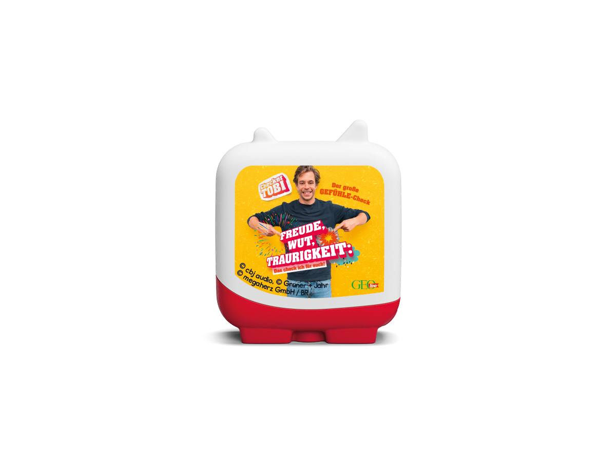 Ein rot-weißes Spielzeug mit gelber Fläche mit Text und einem lächelnden Mann, betitelt "FREUDE, WUT, TRAURIGKEIT".