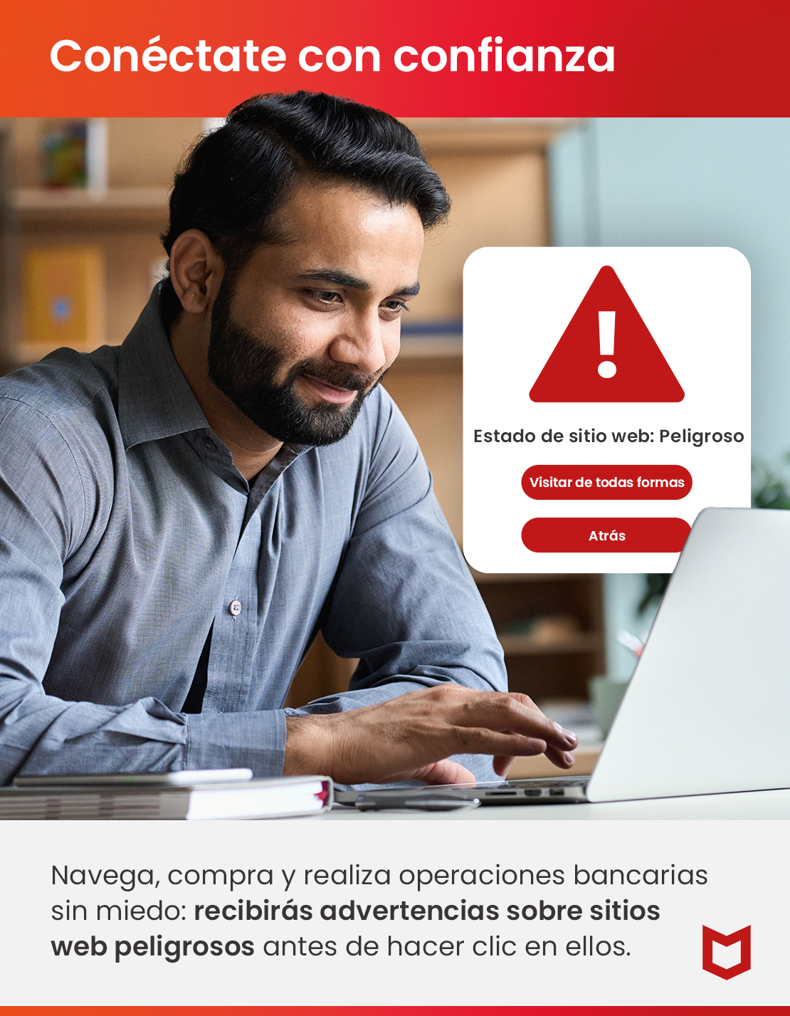 Un hombre usa una computadora portátil con una advertencia roja de sitio web peligroso en la pantalla.