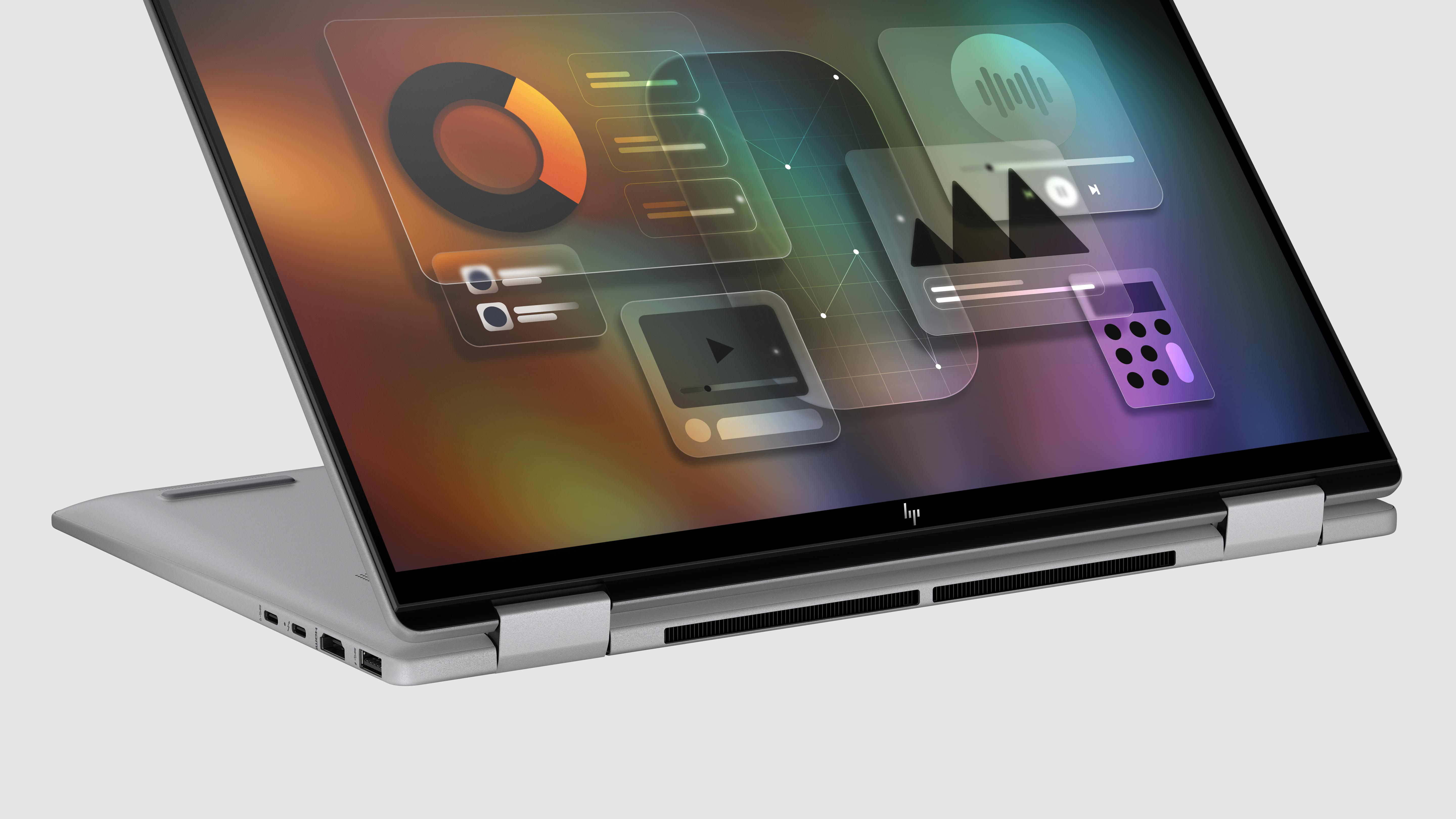 Silberner Laptop, geöffnet mit einem Bildschirm, der Diagramme und Symbole anzeigt.