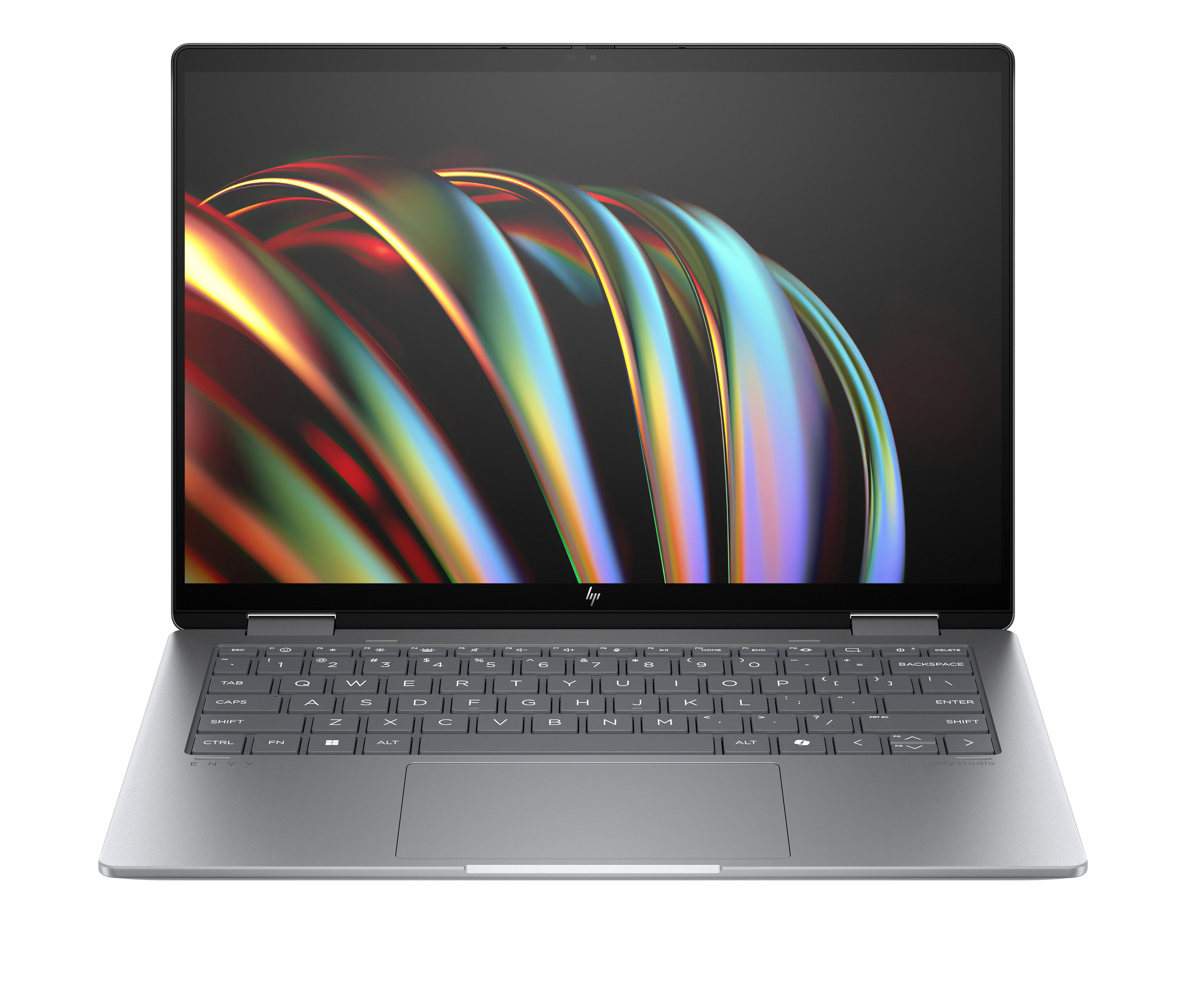 Laptop offen, silberfarben, auf schwarzem Hintergrund. Bildschirm zeigt farbige abstrakte Formen.