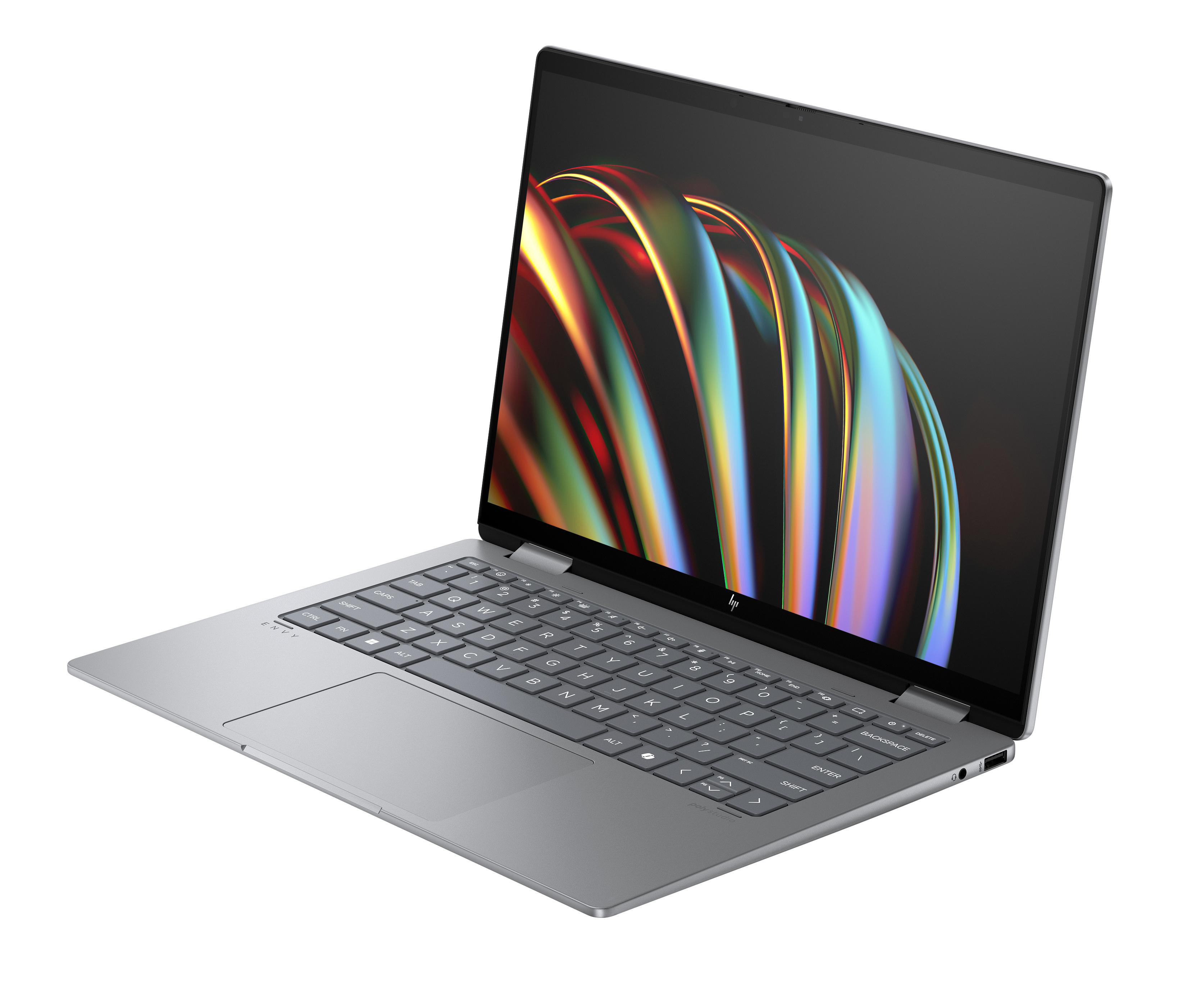 Ein grauer Laptop, geöffnet auf weißem Hintergrund. Der Bildschirm zeigt ein farbenfrohes Design.