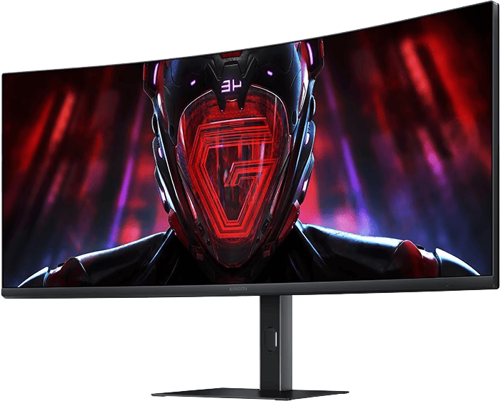 Ívelt gaming monitor egy piros témájú személy grafikájával. Fekete állvány és keret.