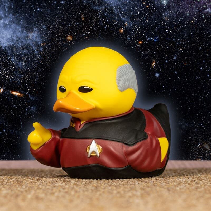 Sárga gumikacsa, mint Kirk kapitány a Star Trek-ből, űrháttérrel.