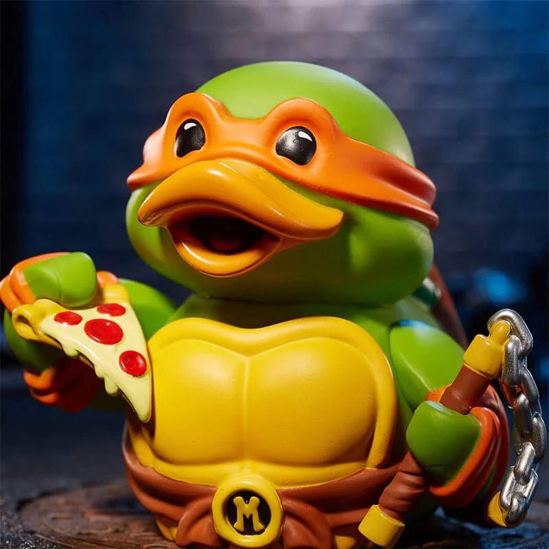 Tini Nindzsa Teknőc játék kacsa pizzával és fegyverrel, narancssárga maszk.