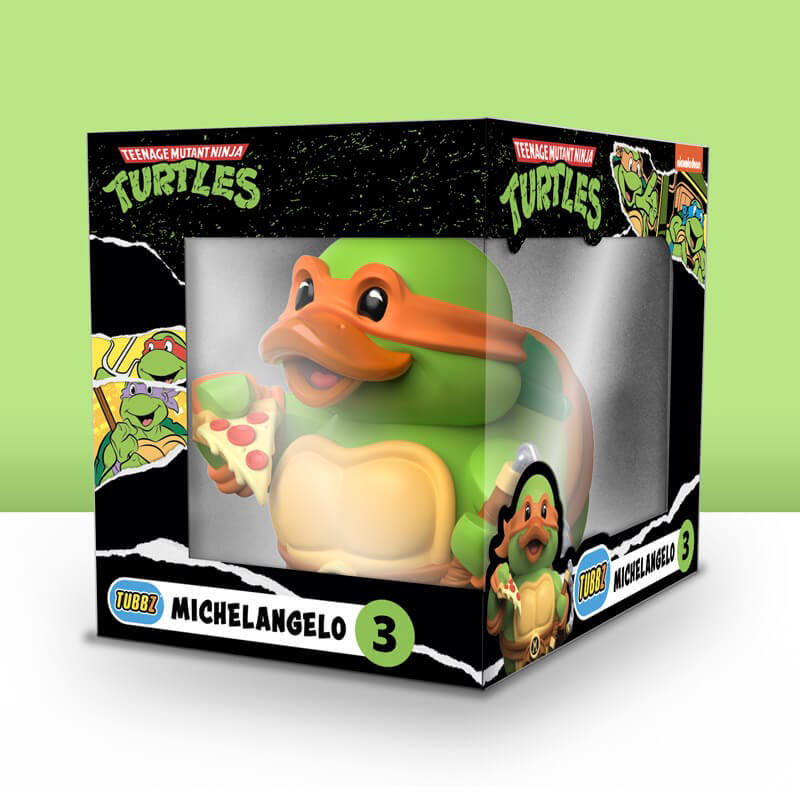 Teenage Mutant Ninja Turtles Michelangelo figura dobozban, pizzát tartva.