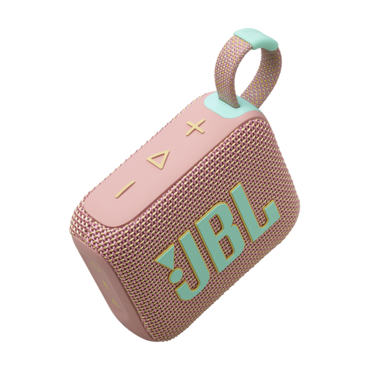 Pembe ve nane yeşili JBL taşınabilir hoparlör, kumaş kayış ve siyah arka plan ile.