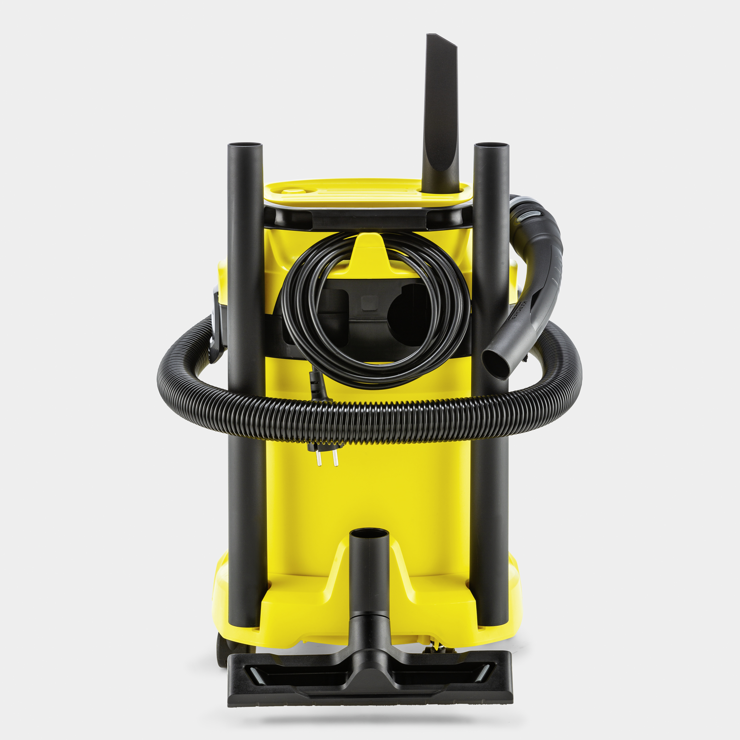 Yellow and black vacuum cleaner with a hose and attachments, standing against a white background.