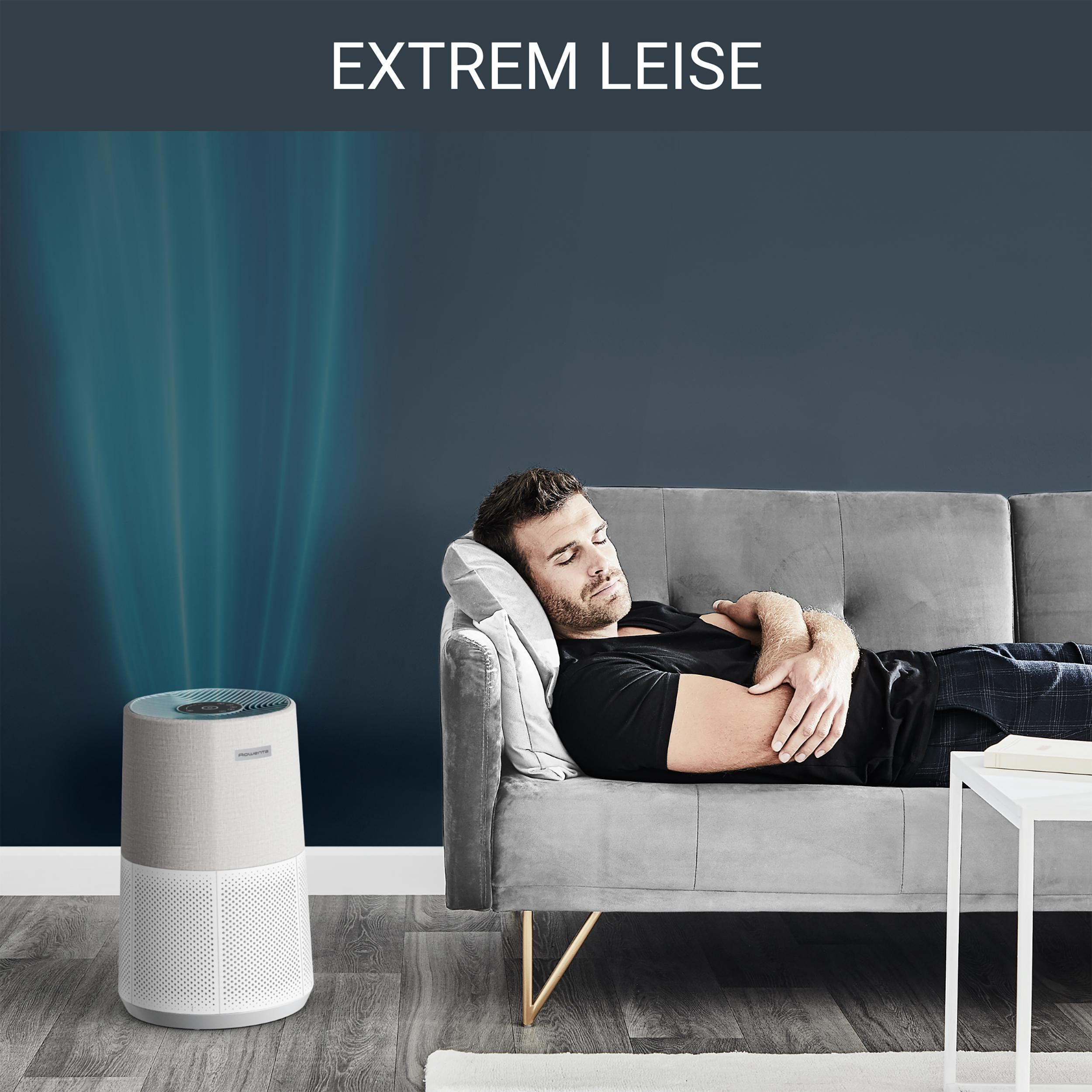 Ein Mann schläft auf einem Sofa, ein Luftreiniger und der Text 'EXTREM LEISE'.