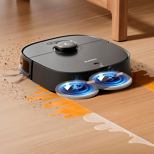 Ein Roboter-Staubsauger reinigt einen Holzboden. Es gibt zwei blaue Lichter.