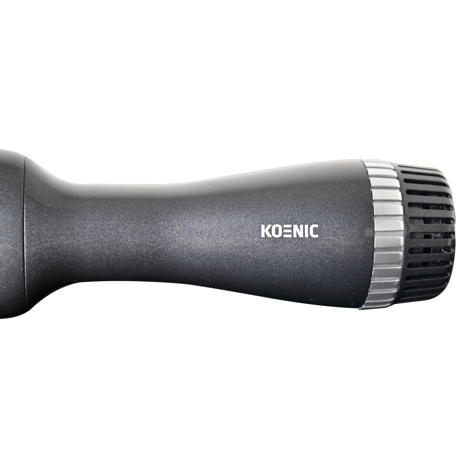 Koenic hair dryer, black, with a silver, ridged nozzle, on a black background.