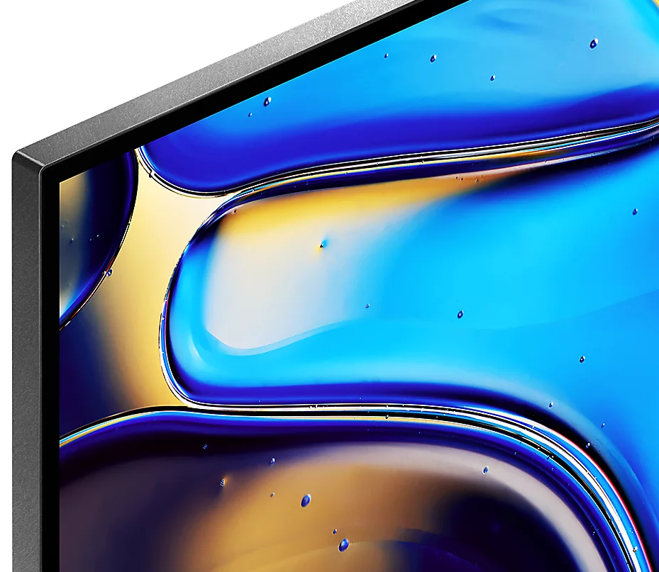 Zbliżenie monitora komputera z niebiesko-żółtym abstrakcyjnym tłem.