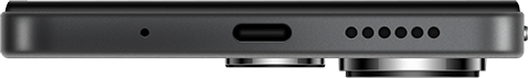 Egy telefon alsó szélének közeli képe mikrofonnal, USB-C porttal és hangszórókkal.