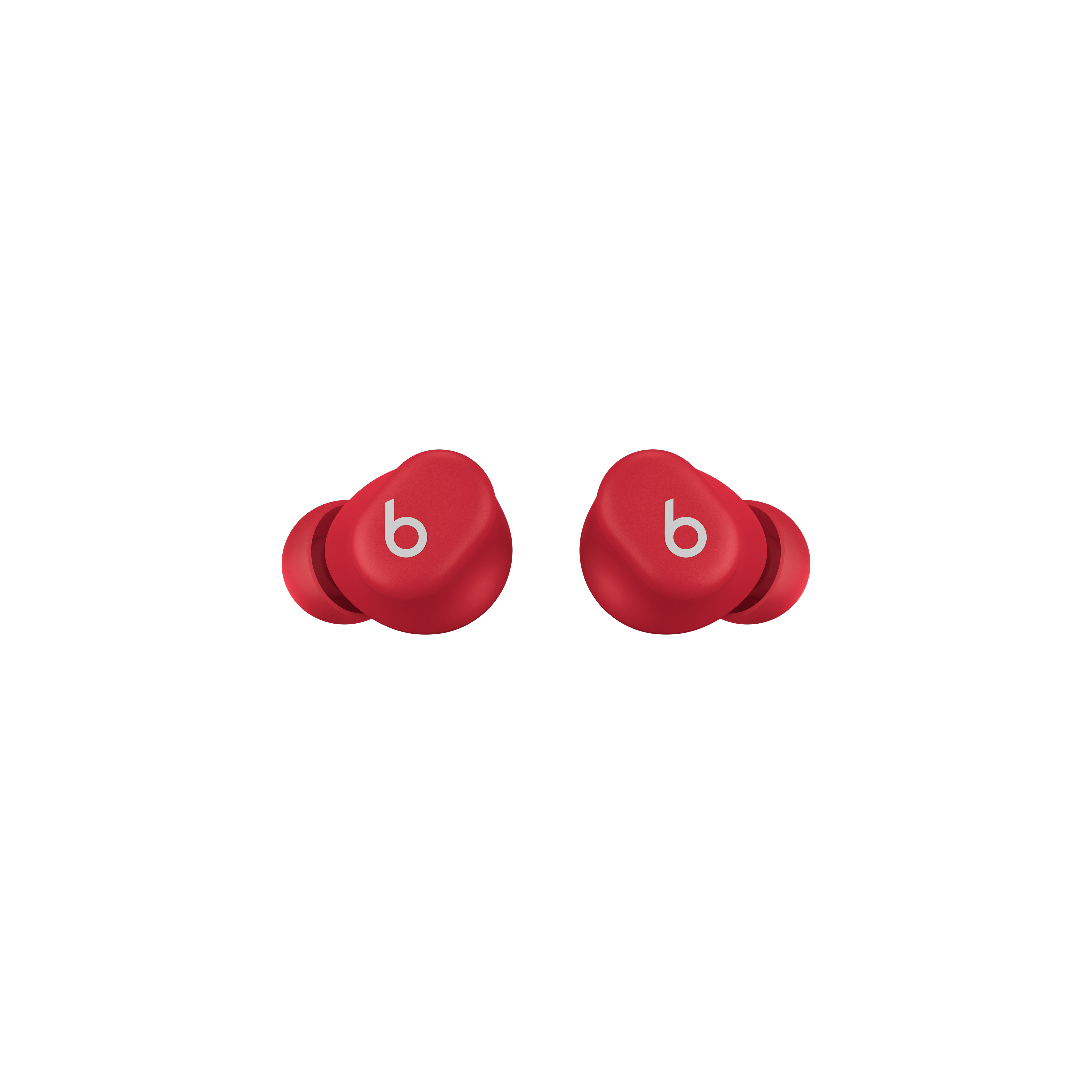 Dos auriculares Beats rojos, fondo blanco, cada uno con el logo 'b' en blanco.