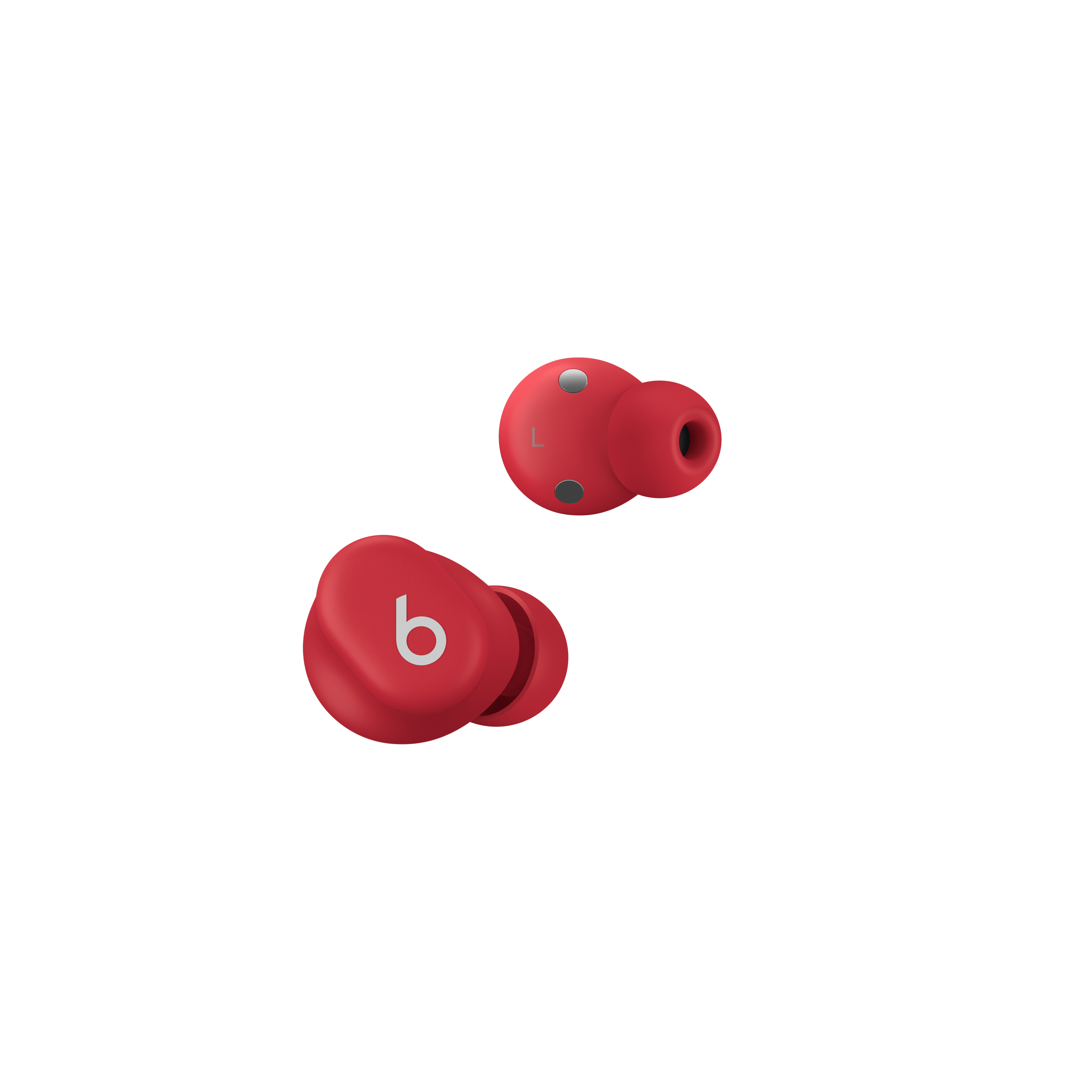 Dos auriculares Beats rojos, aislados sobre fondo blanco. Vista de cerca con detalles del diseño.