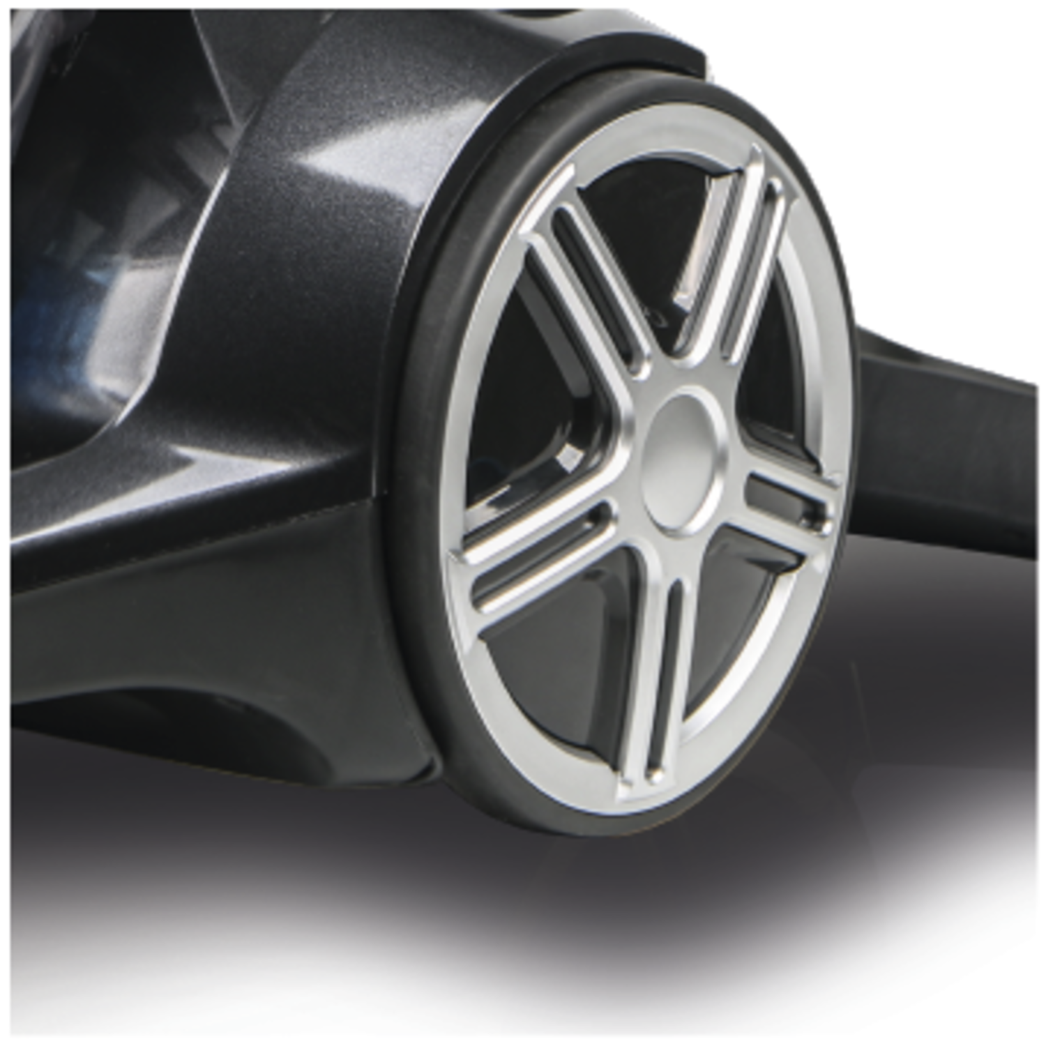 Close-up of a vacuum cleaner wheel. The wheel is silver with a black tire and a dark gray body.