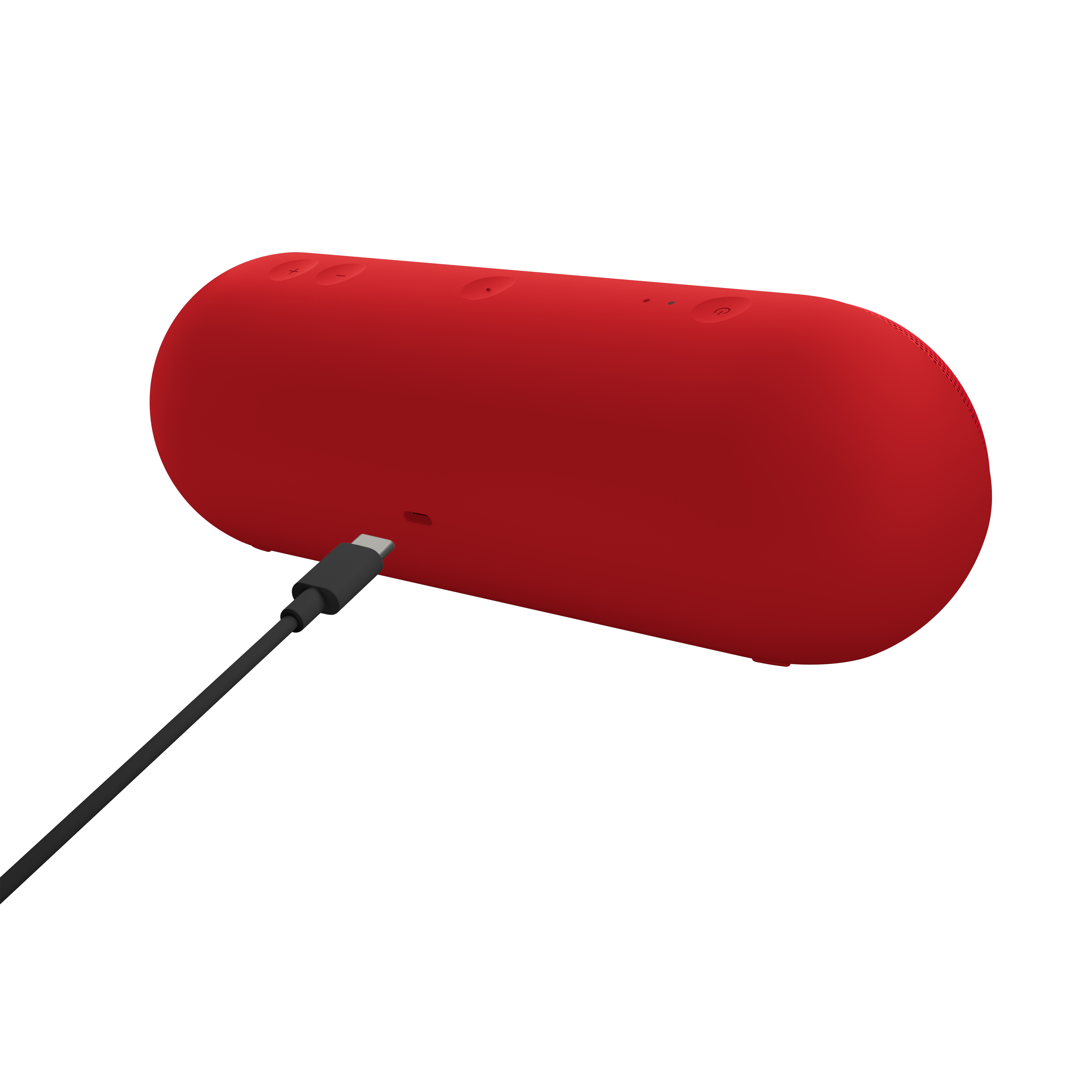 Altavoz rojo de forma ovalada con un cable de carga negro enchufado, sobre un fondo blanco.