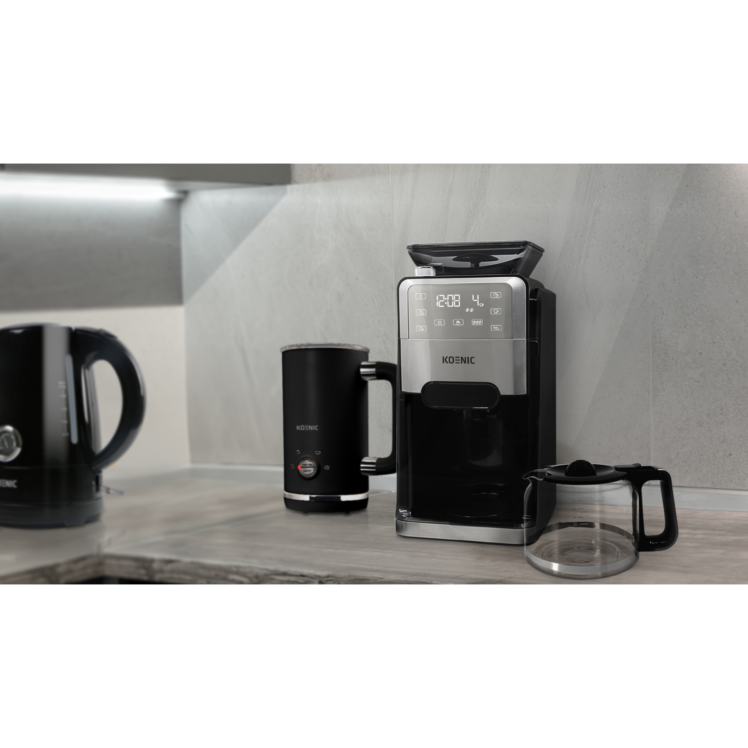 Kitchen appliances, black kettle, milk frother, coffee machine.