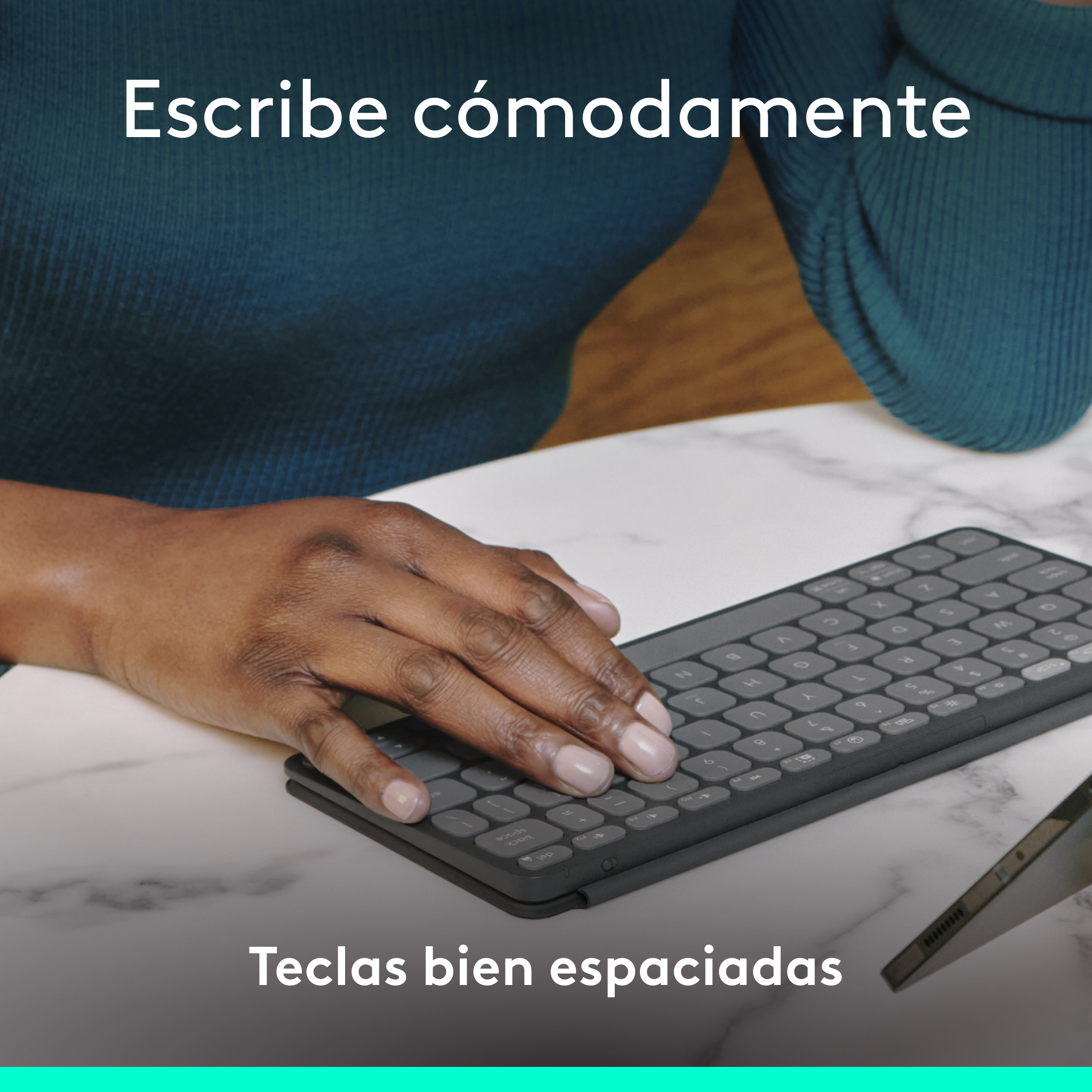 Manos de una persona en un teclado. El texto dice: 'Escribe cómodamente' y 'Teclas bien espaciadas'.