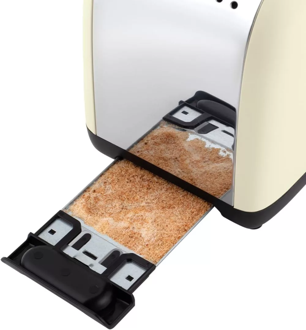 Tostapane con il vassoio raccogli briciole estratto, che mostra le briciole all'interno. Finitura beige e cromata.