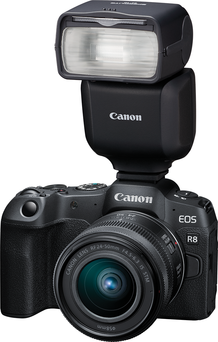 Appareil photo Canon noir avec flash. Il a un objectif et la marque 'Canon' sur l'appareil.