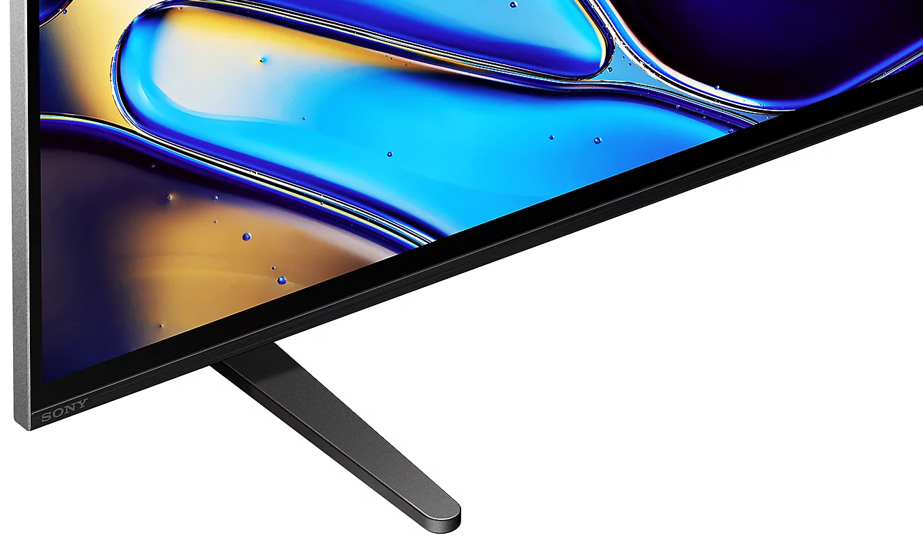 Ekran telewizora ze stojakiem. Ekran wyświetla niebieski i żółty wzór abstrakcyjny.