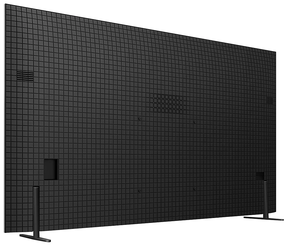 Widok z tyłu dużego czarnego telewizora z wzorem siatki. Telewizor stoi na dwóch czarnych nogach.