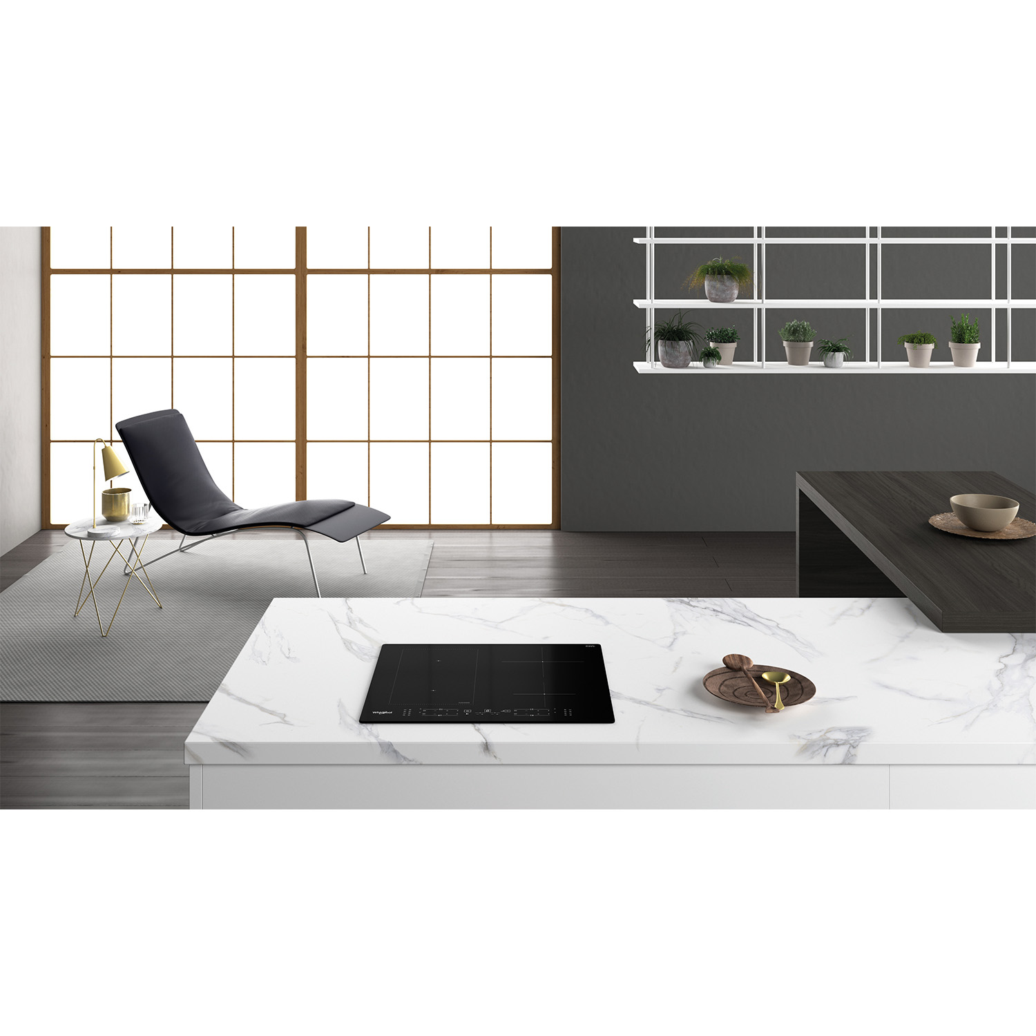 Un piano di lavoro della cucina con un piano cottura a induzione nero e decorazioni.