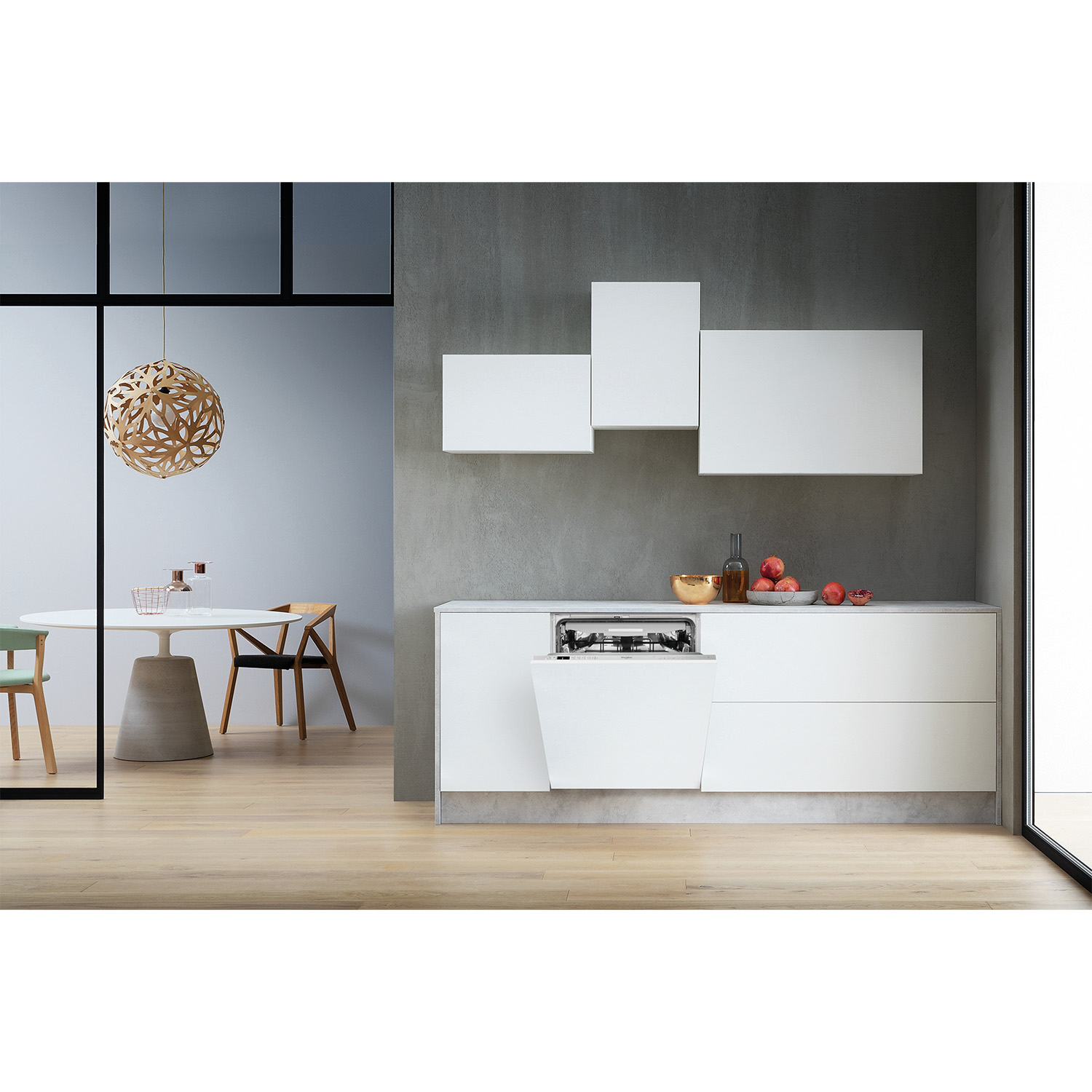Una cucina moderna, con mobili bianchi e zona pranzo.