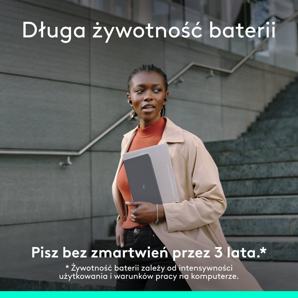 Kobieta z laptopem, wchodzi po schodach, polski tekst o baterii.