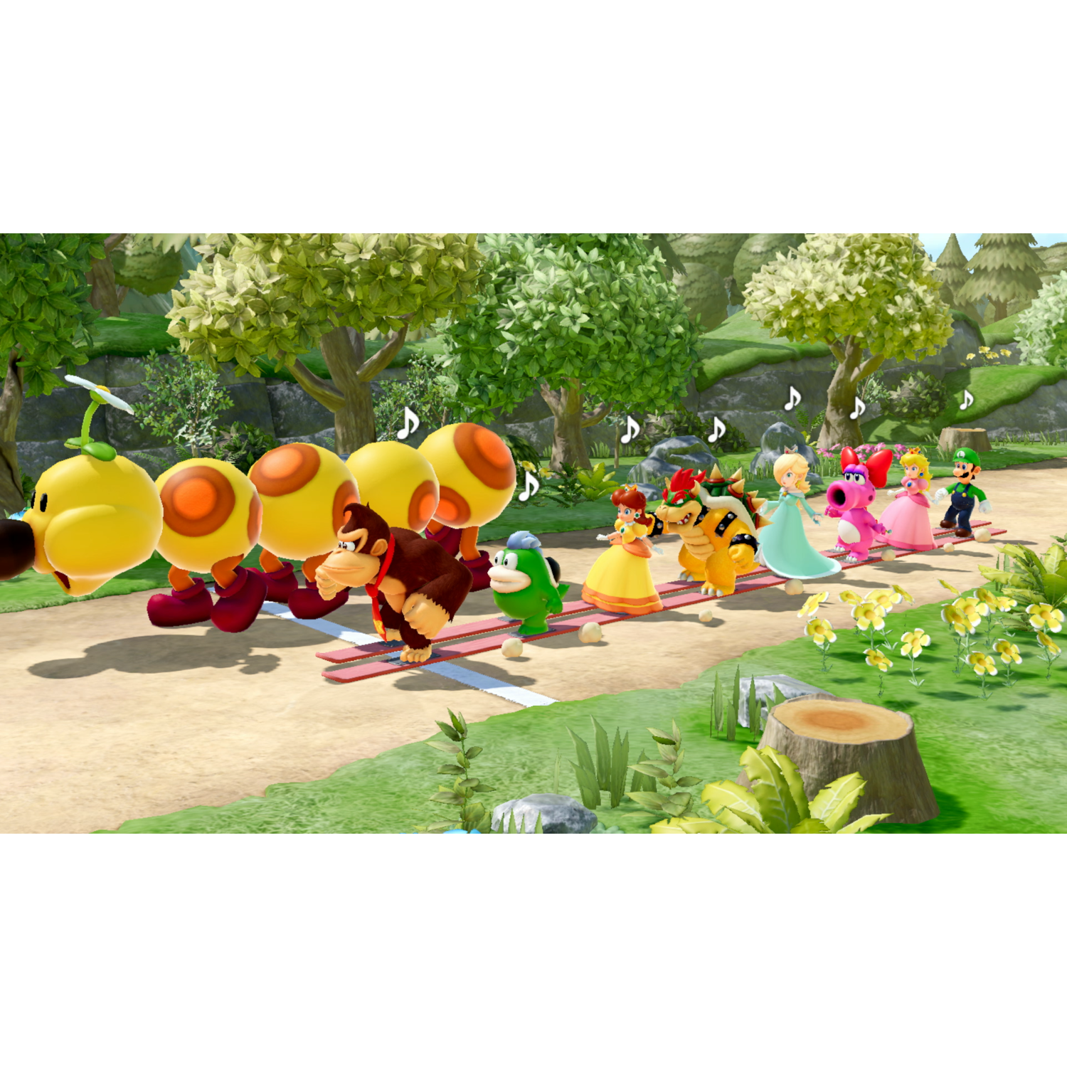 Mario characters racing on a track. Characters include: Donkey Kong, Princess Peach, and others. Trees in background.