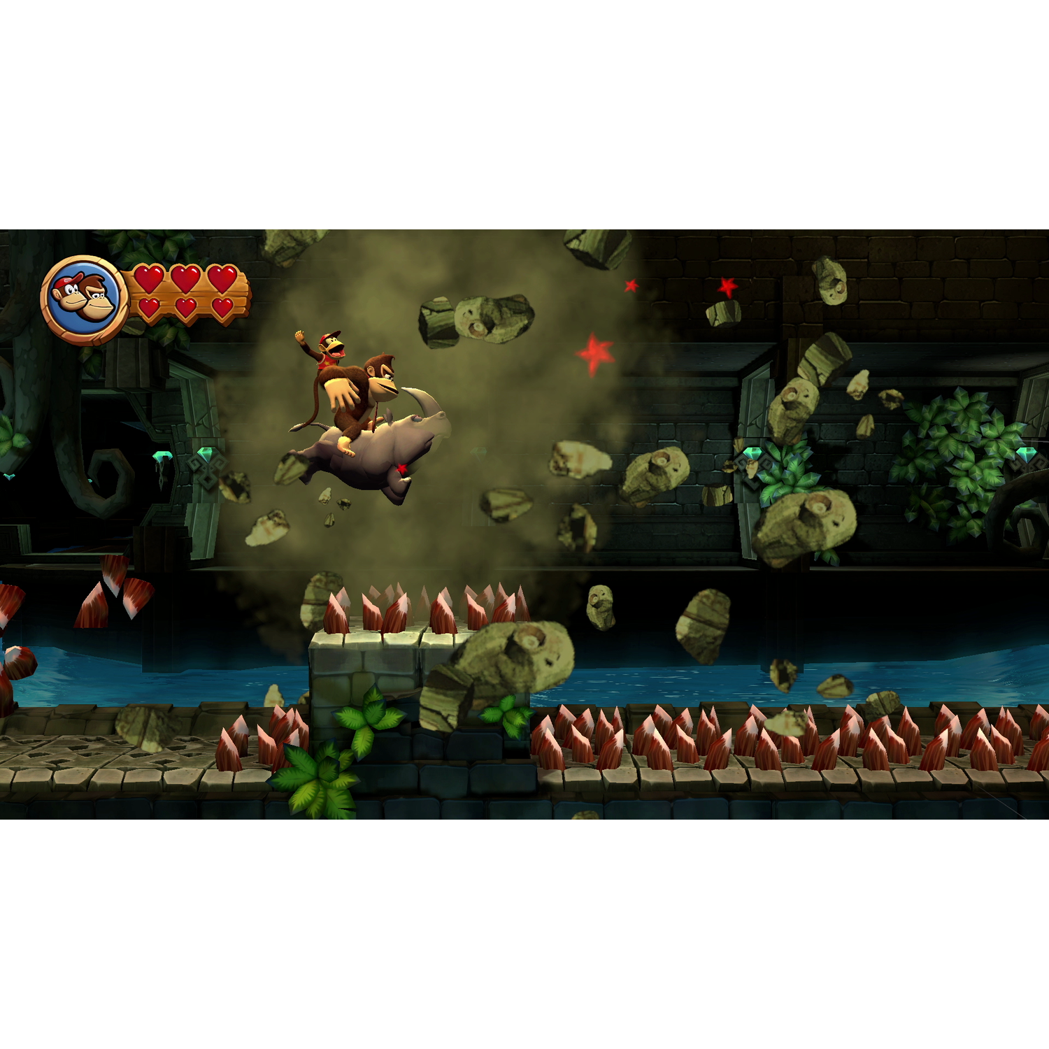 Donkey Kong en Diddy Kong op een neushoorn in een videogame scène met water en puin.