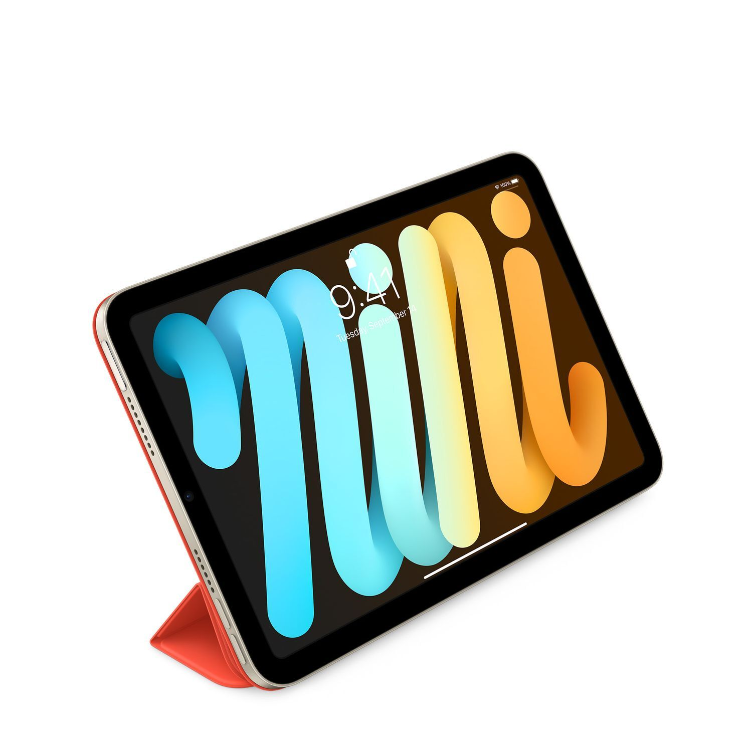 Un iPad Mini dans un étui rouge, affichant un écran coloré sur fond blanc.