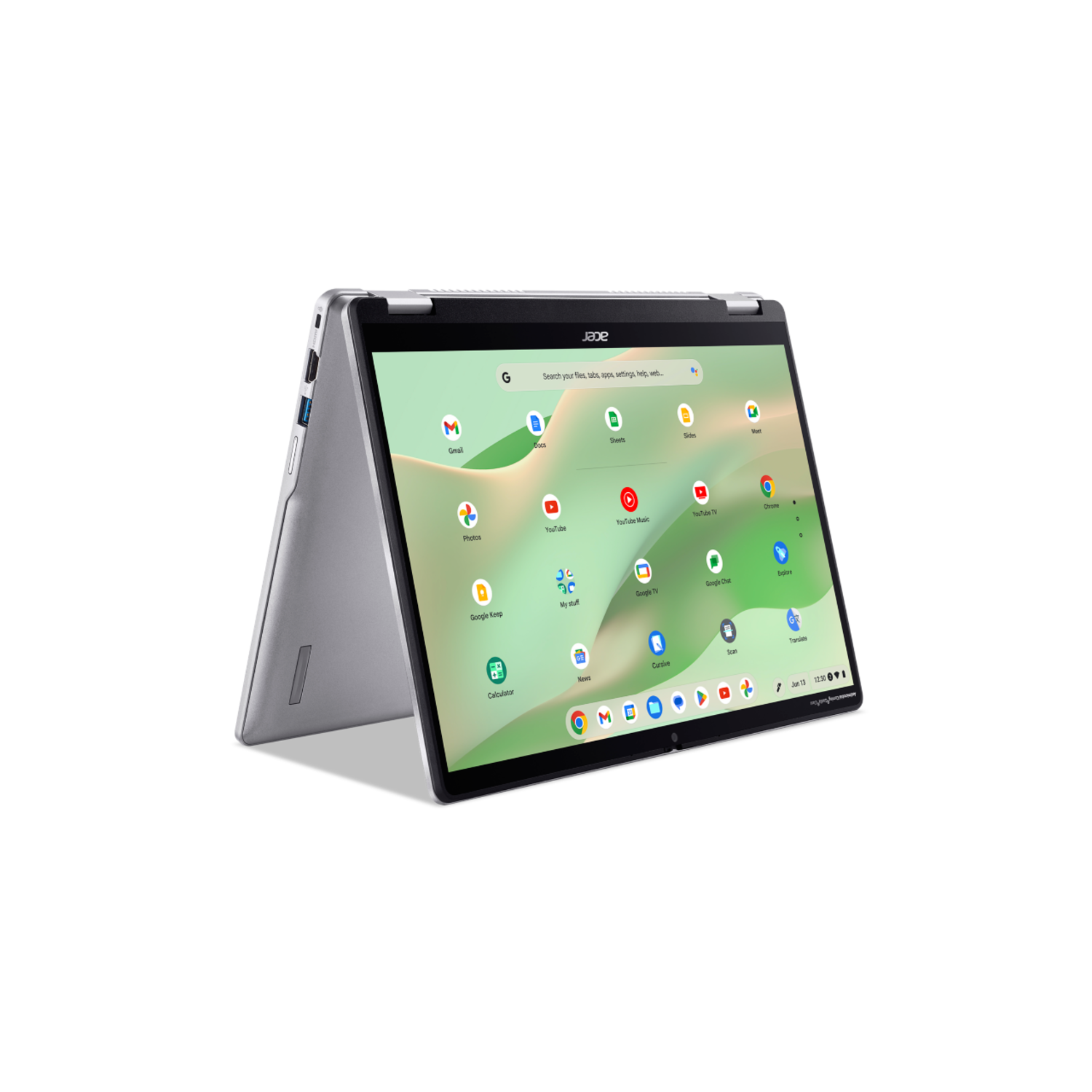 A silver laptop on a black surface, open and angled.