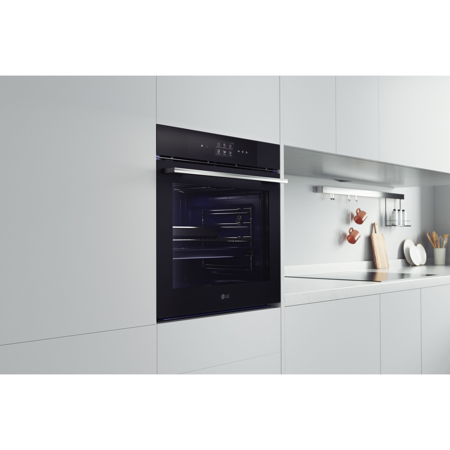 Un forno LG nero, integrato in un mobile da cucina bianco.