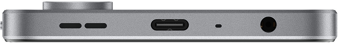 Widok z boku srebrnego urządzenia z różnymi portami i przyciskiem.