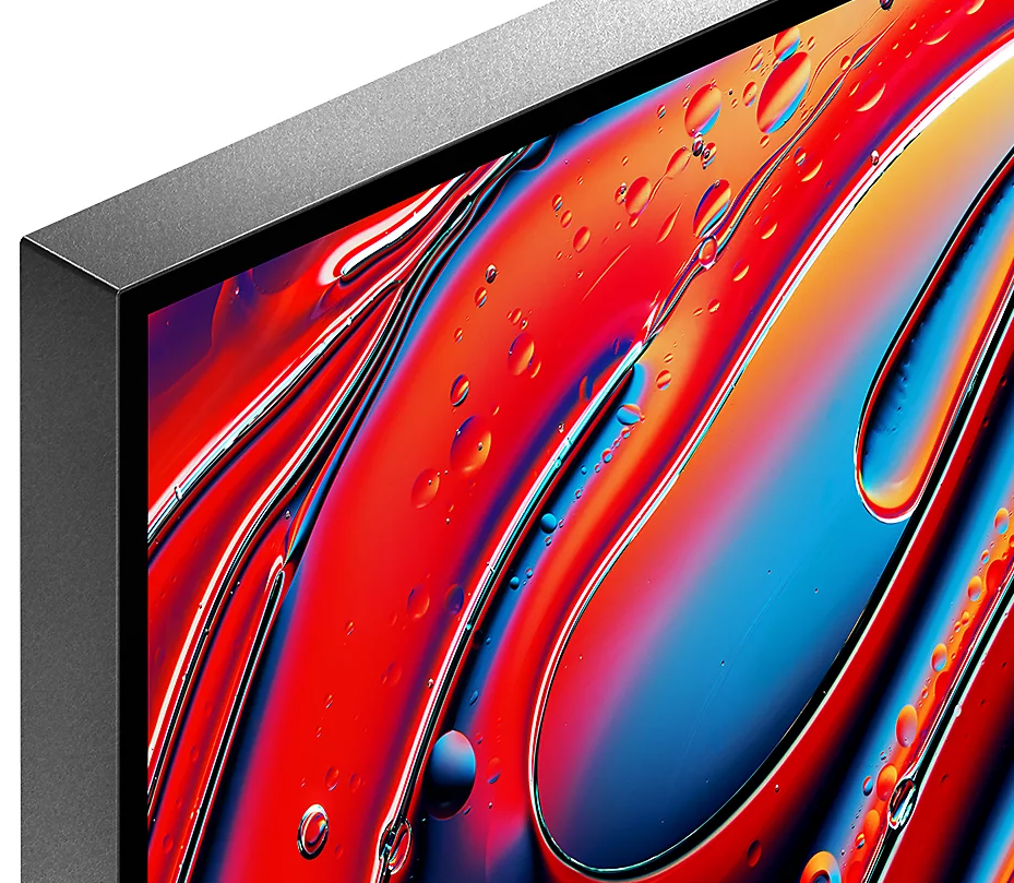 Zbliżenie na ekran z abstrakcyjną sztuką. Czerwienie, błękity i krople wody.