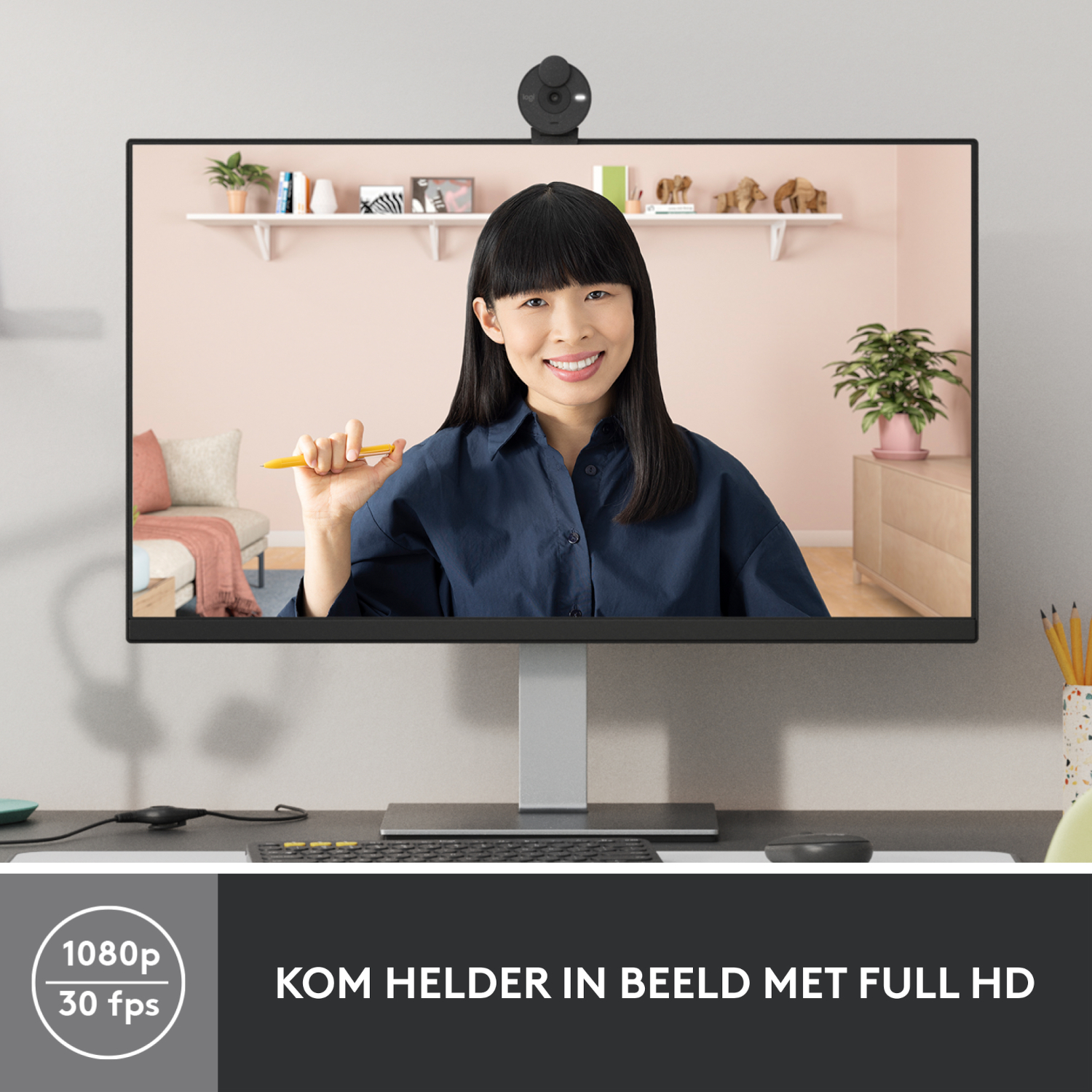 Woman on a monitor with a webcam and text: 'KOM HELDER IN BEELD MET FULL HD'.