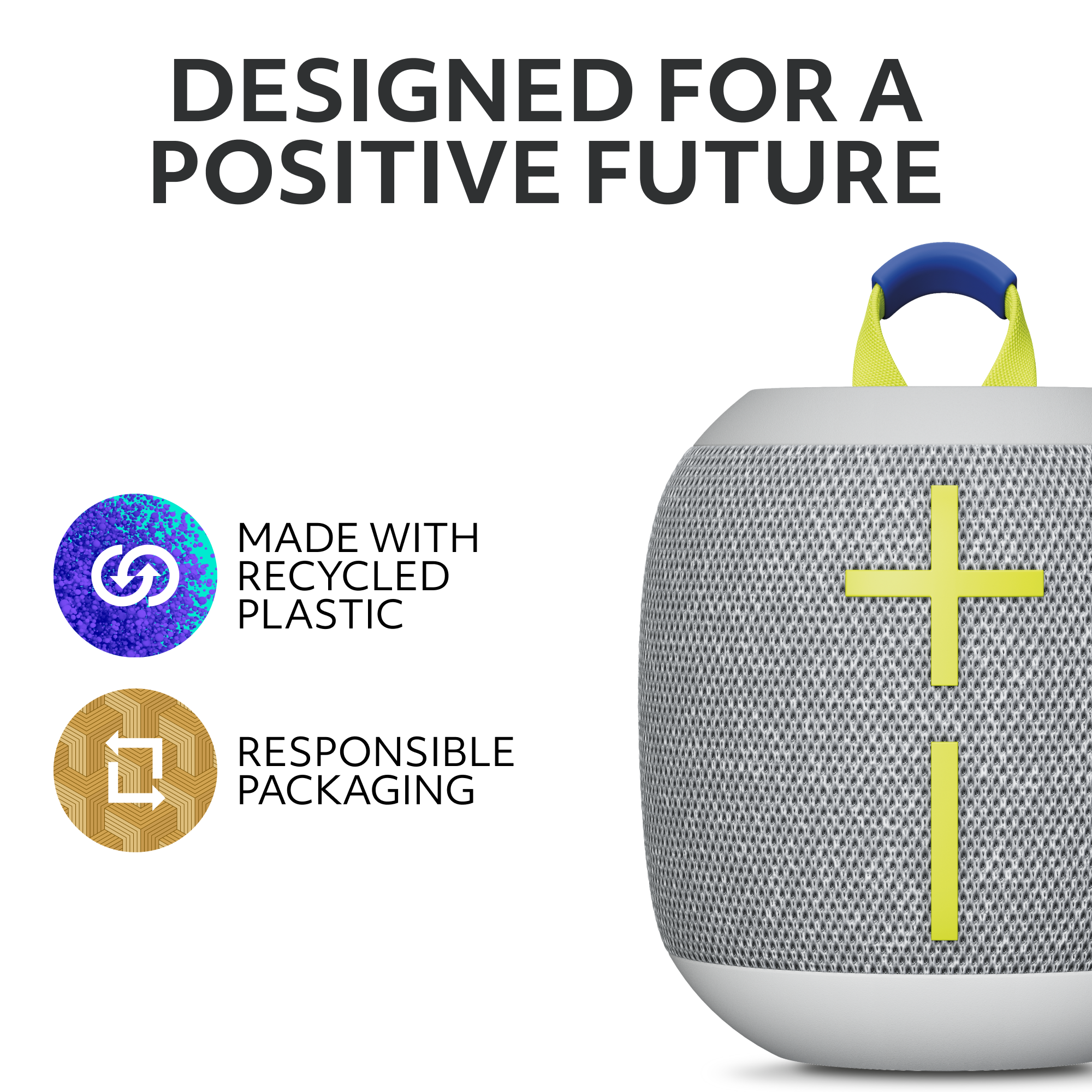 Weißer Lautsprecher mit gelbem Kreuzdesign und blauem Griff. Text: 'DESIGNED FOR A POSITIVE FUTURE'.