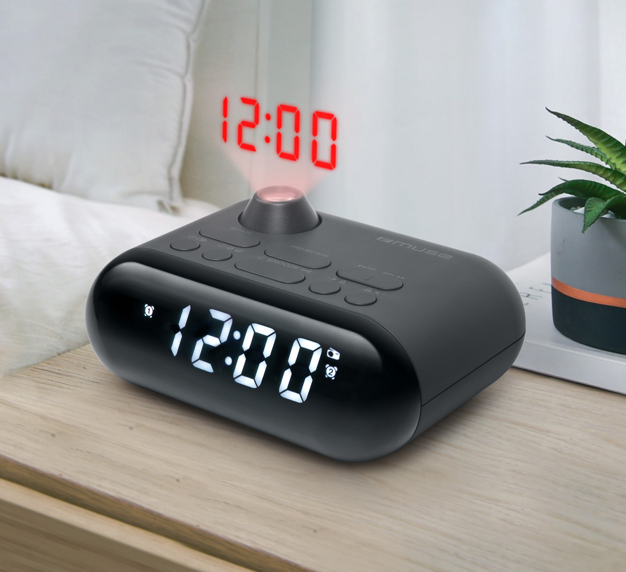Fekete digitális ébresztőóra 12:00-t mutat, piros kivetítéssel.