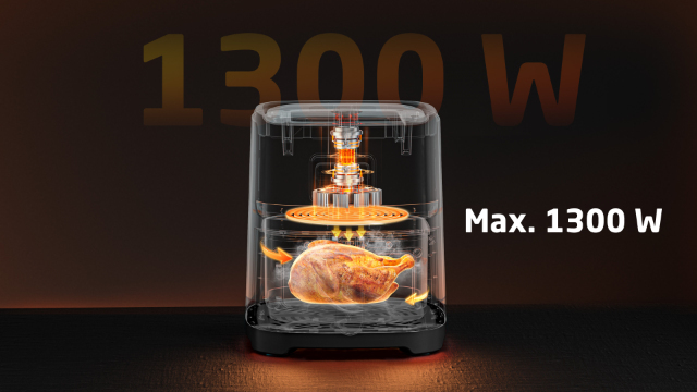 Un airfryer montre un poulet cuit à l'intérieur, avec le niveau de puissance de 1300W affiché en haut.