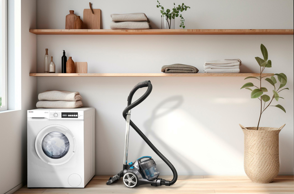 A washing machine and vacuum cleaner in a laundry room.