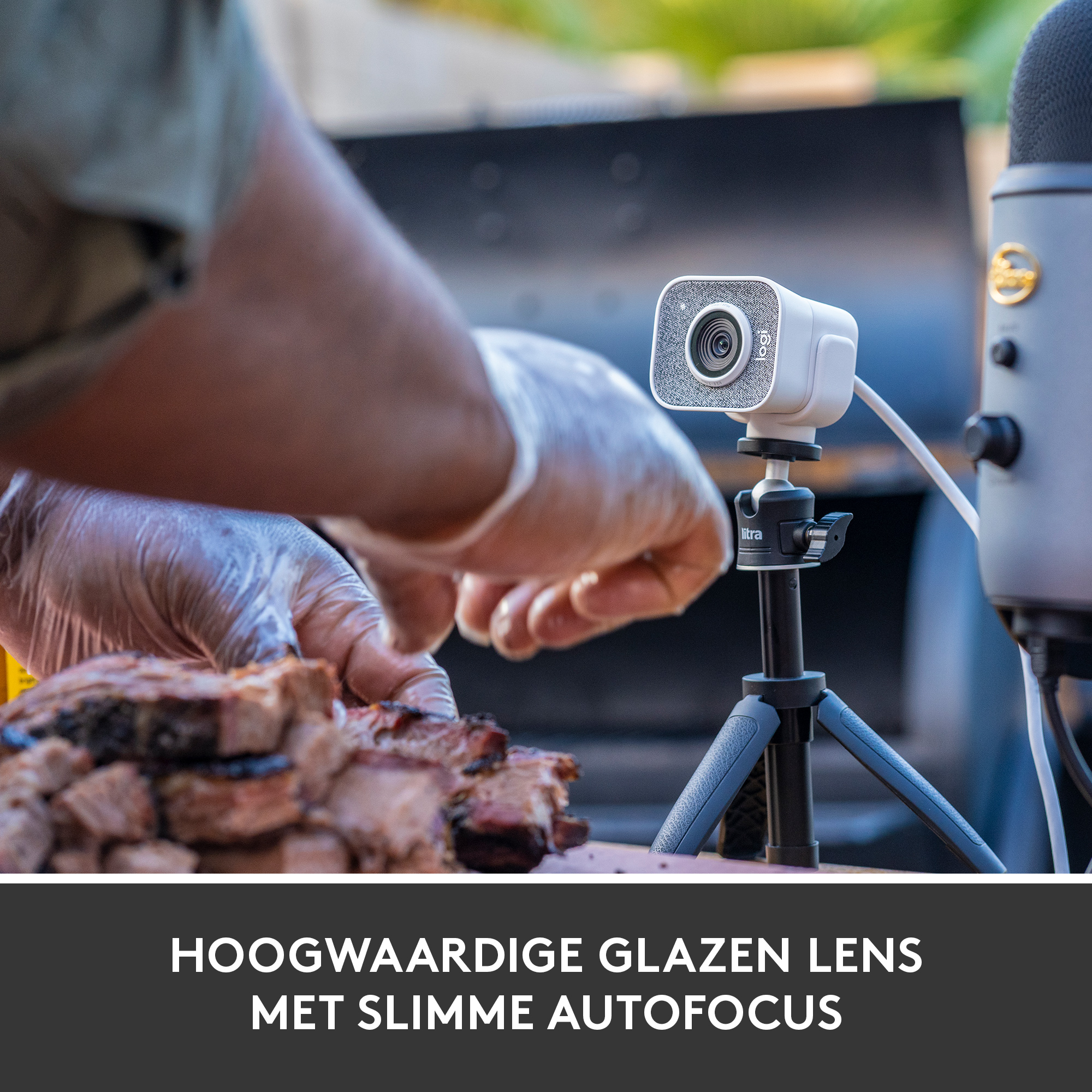 A person is preparing food for a barbecue, there is a camera and a microphone.