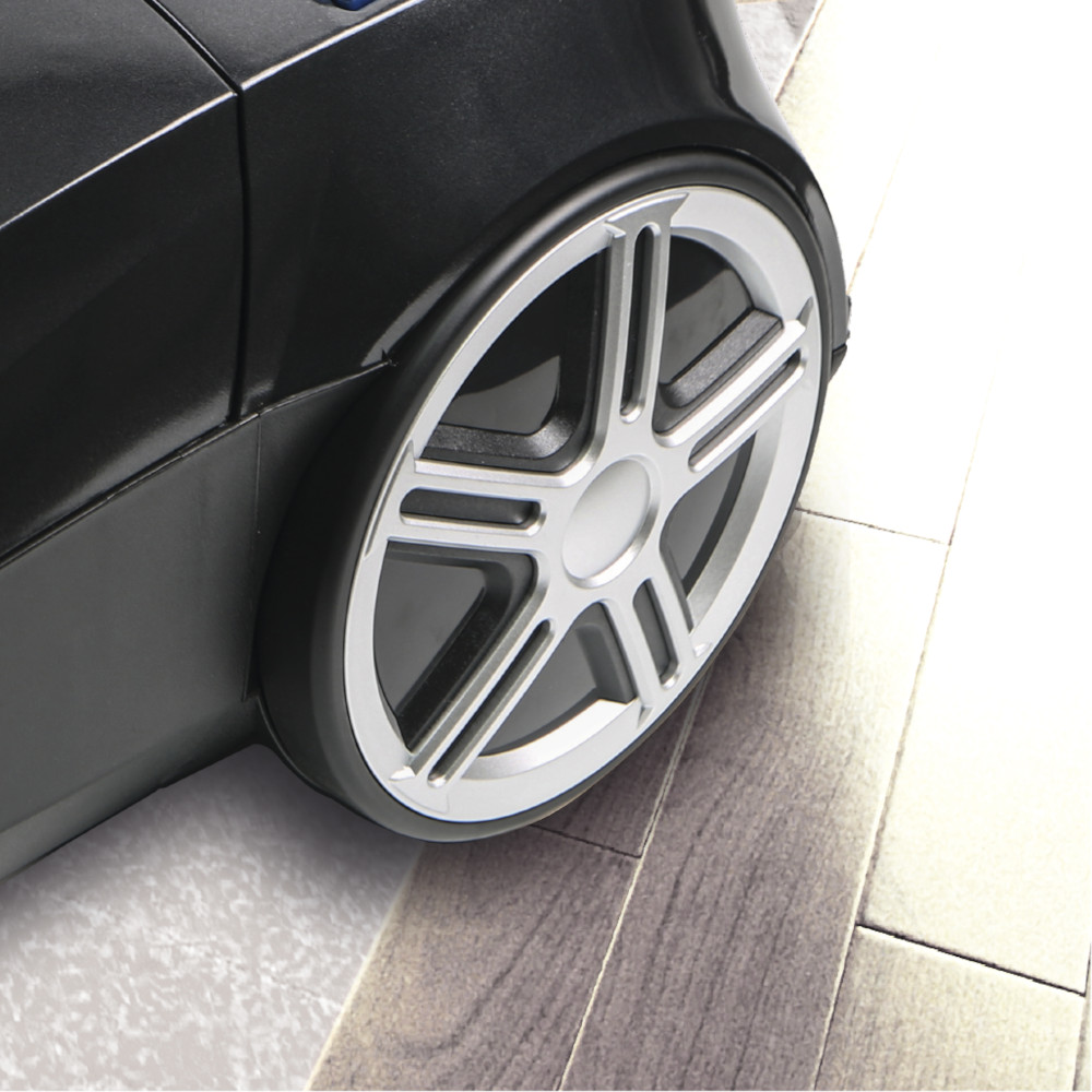 A close-up of a black vacuum cleaner wheel with a silver design.