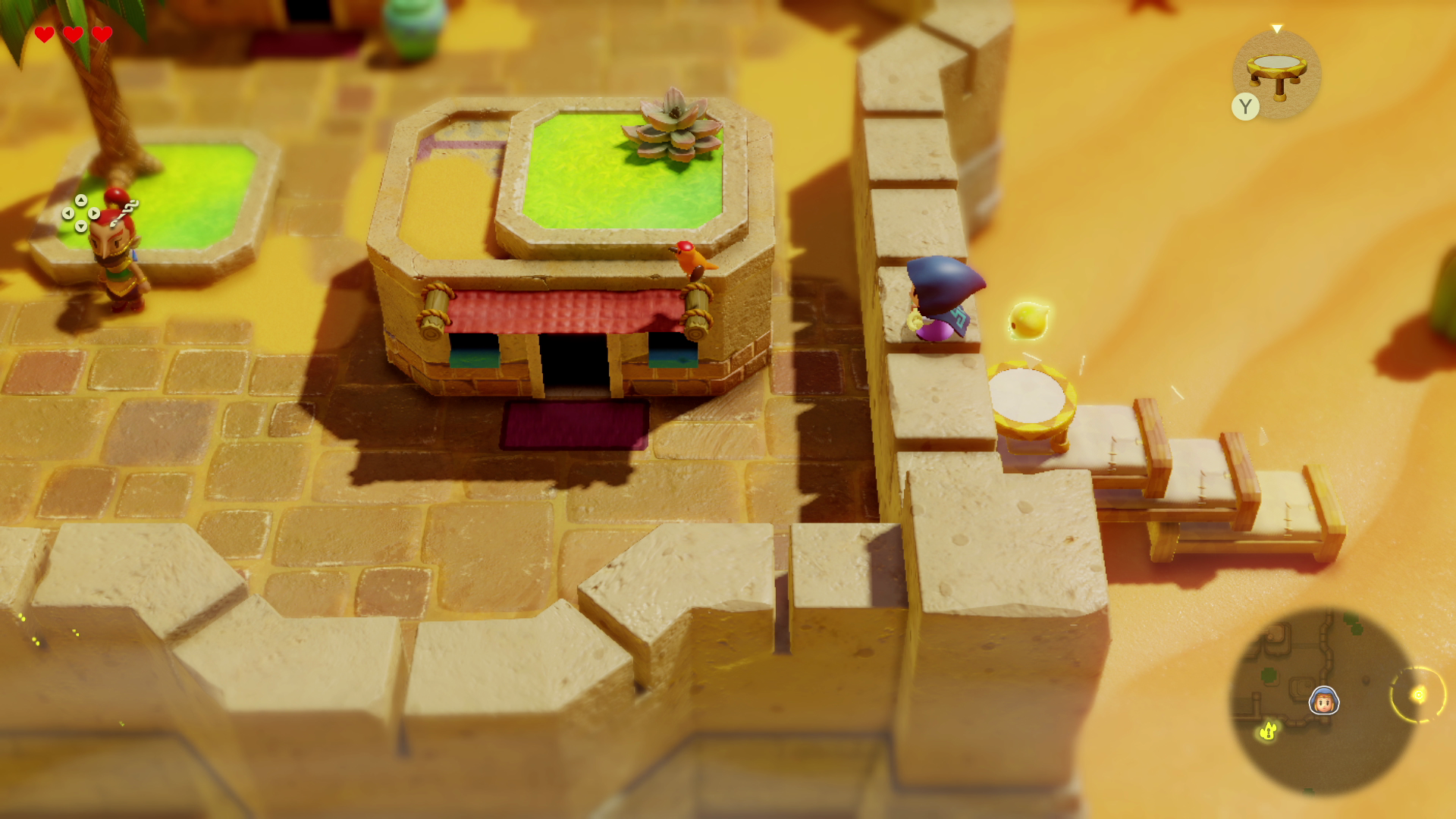 Vista isometrica di una scena di videogioco. Vengono mostrati un edificio e un personaggio.