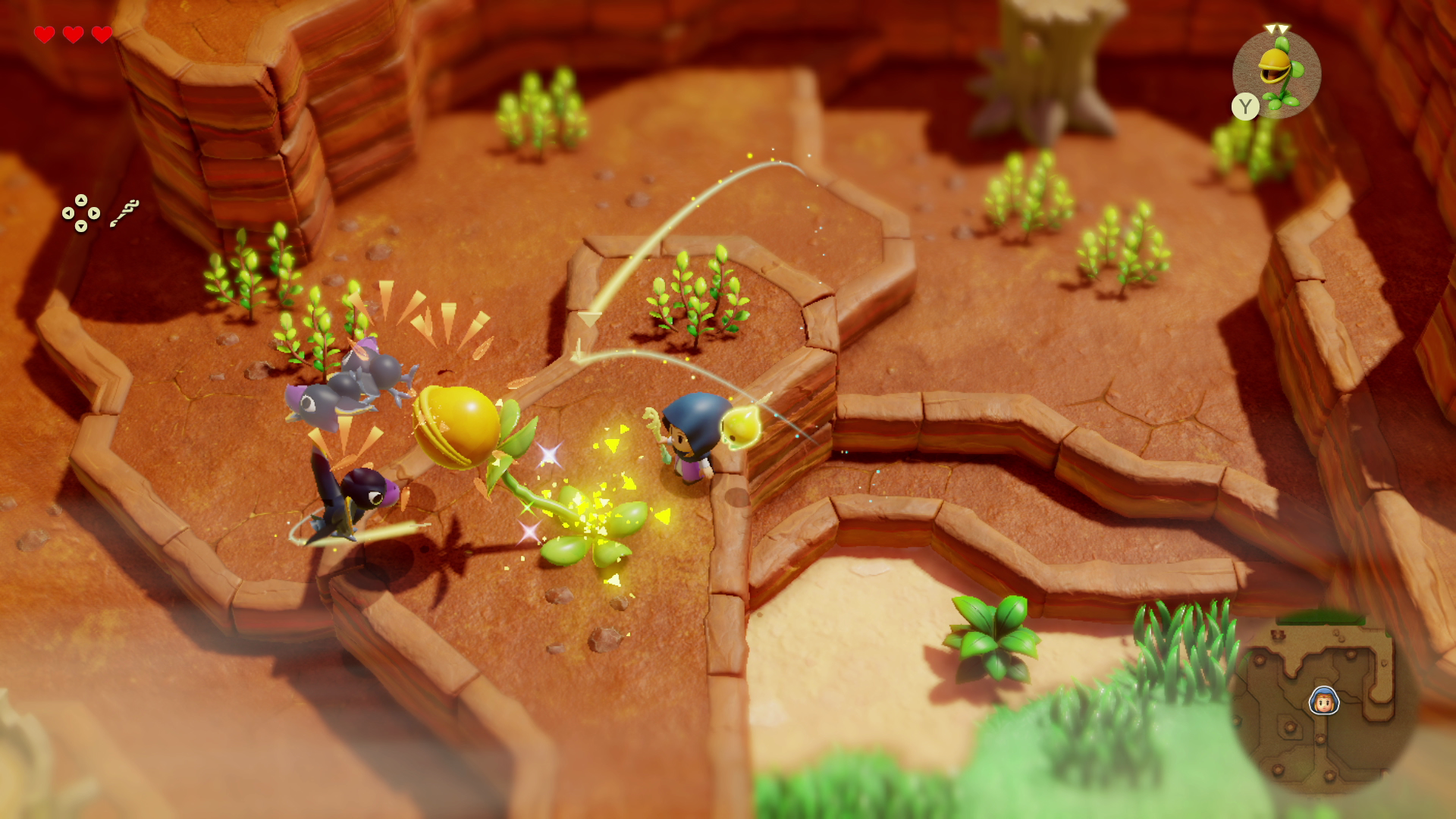 Scena di videogioco con personaggio e nemici su terreno marrone con piante e chiavi.